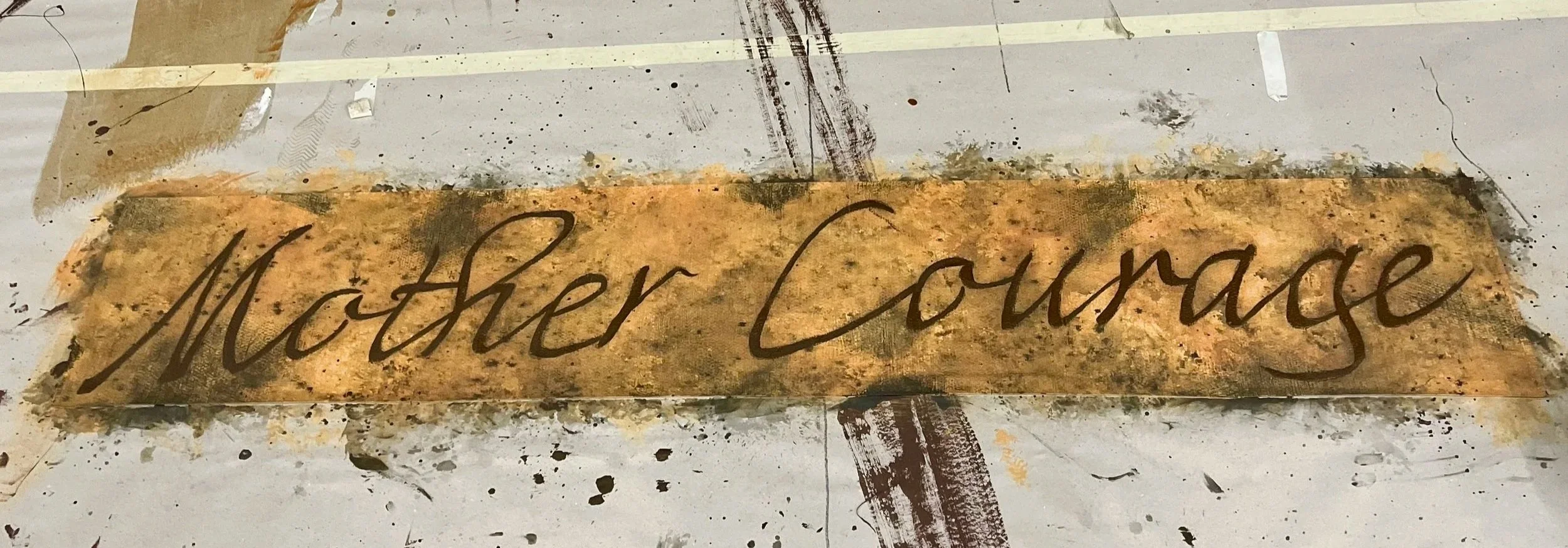 Banner for UNCSA's production of "Mother Courage" (2023) Scenic Designer: Nikolas Sorreno Charge Painter: Lauren Eckard