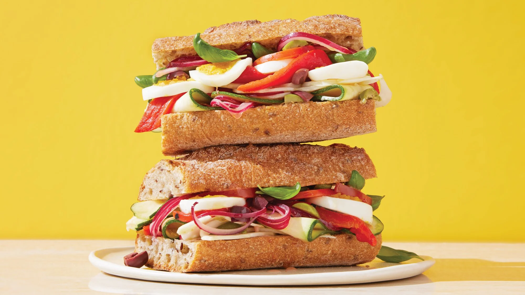 CleanEating_CE102Spring2022_Mediterranean_TOC_Extra-Veggie-Pan-Bagnat-Sandwich_web.jpg