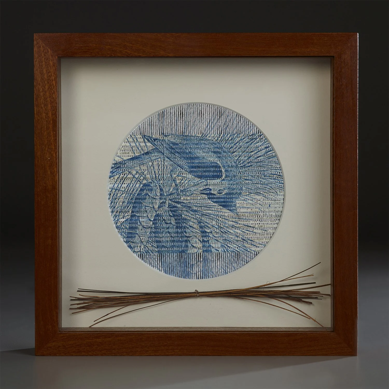 A framed white and blue multi media piece by Vicki Essig