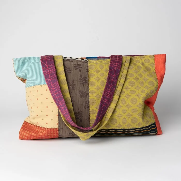 A multi-colored quilted handbag by Nita Forde