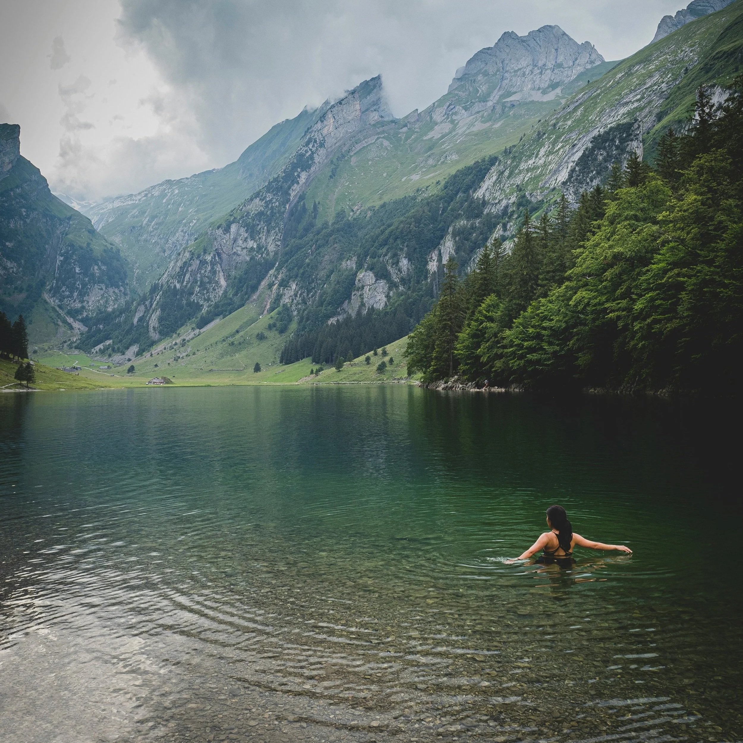 woman sitting near lake in summer, pitta season ayurveda