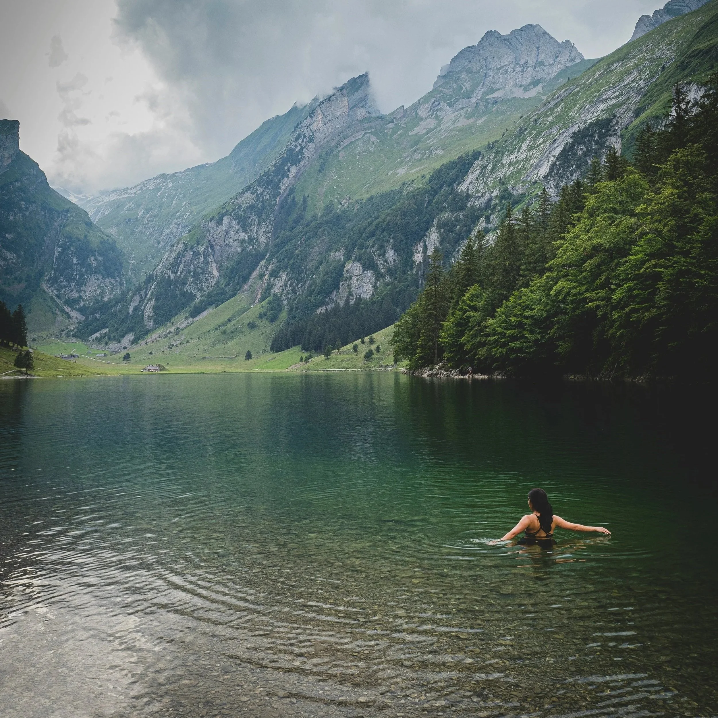 woman sitting near lake in summer, pitta season ayurveda