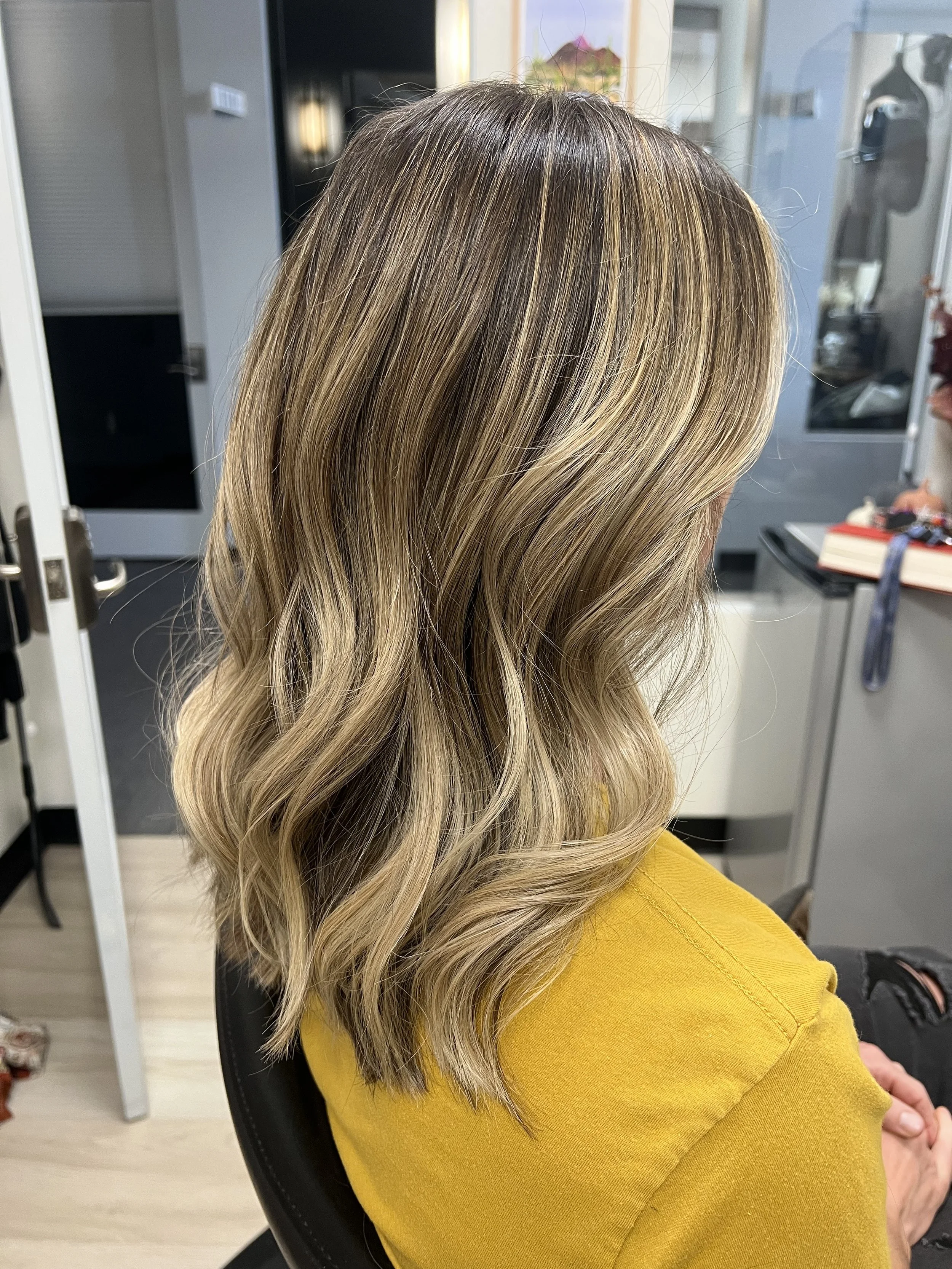 partial highlight with gloss and haircut. Brunette haircolor with blonde highlights in Grand Junction, Colorado