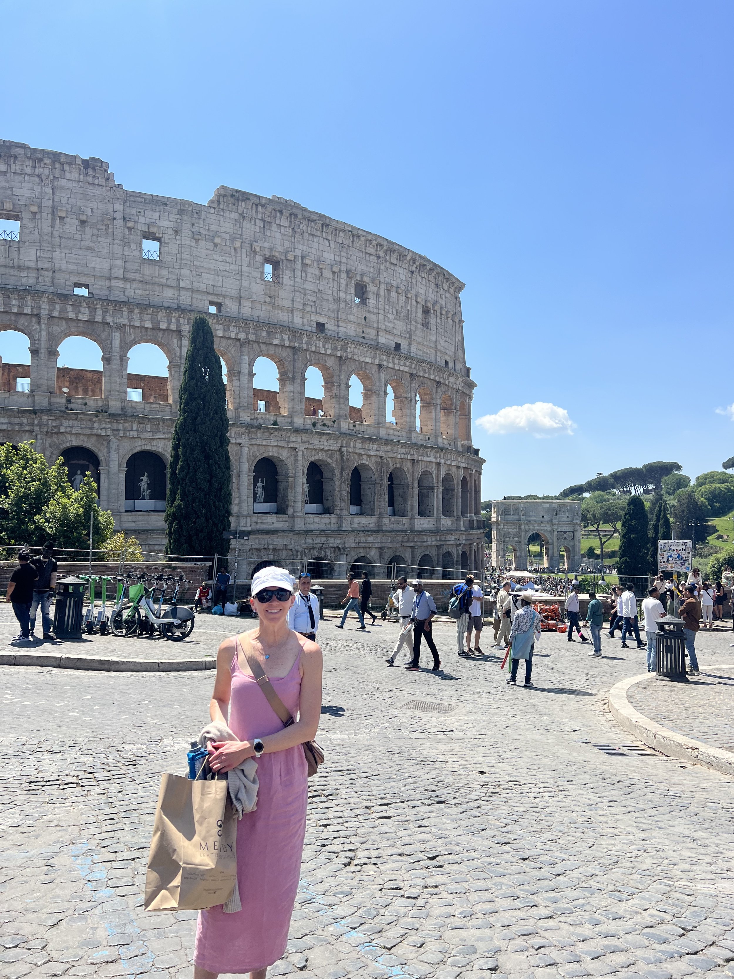 Annji traveling in Rome, outside of the Colosseum