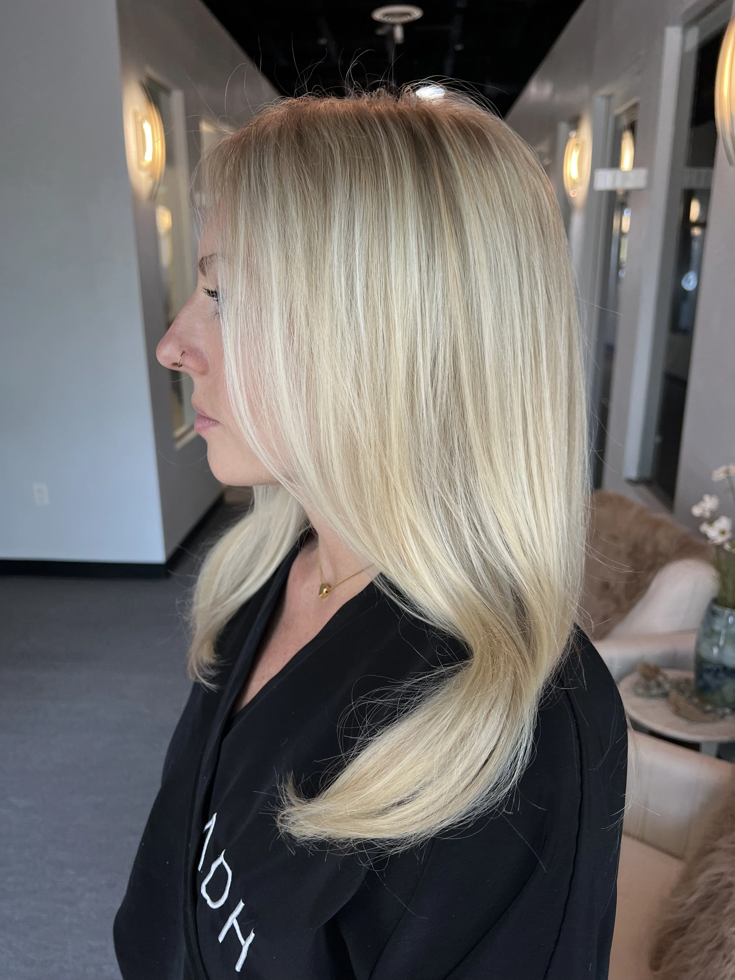 Custom bright blonde hair color with seamless dimension and a soft, lived-in finish, created by a blonde specialist for women on Colorado's Western Slope.
