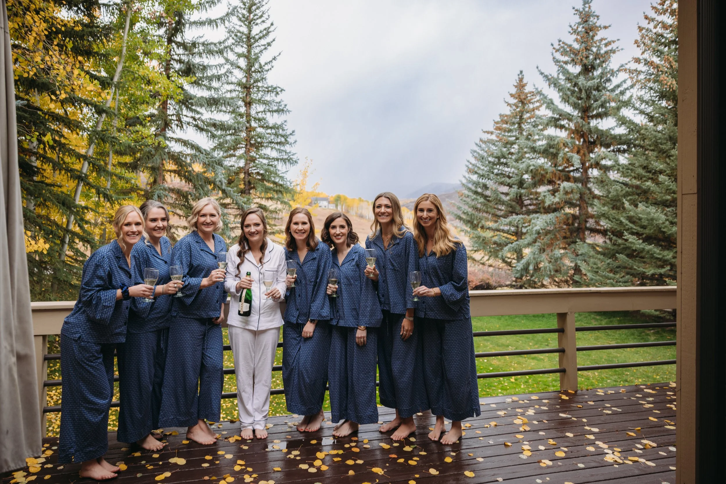 A beautiful Snowmass, Colorado bride wearing a romantic half-up bridal hairstyle with seamless hair extensions. Soft waves and added volume created an elegant, timeless look perfect for her mountain wedding, showcasing luxury bridal hair styling in A