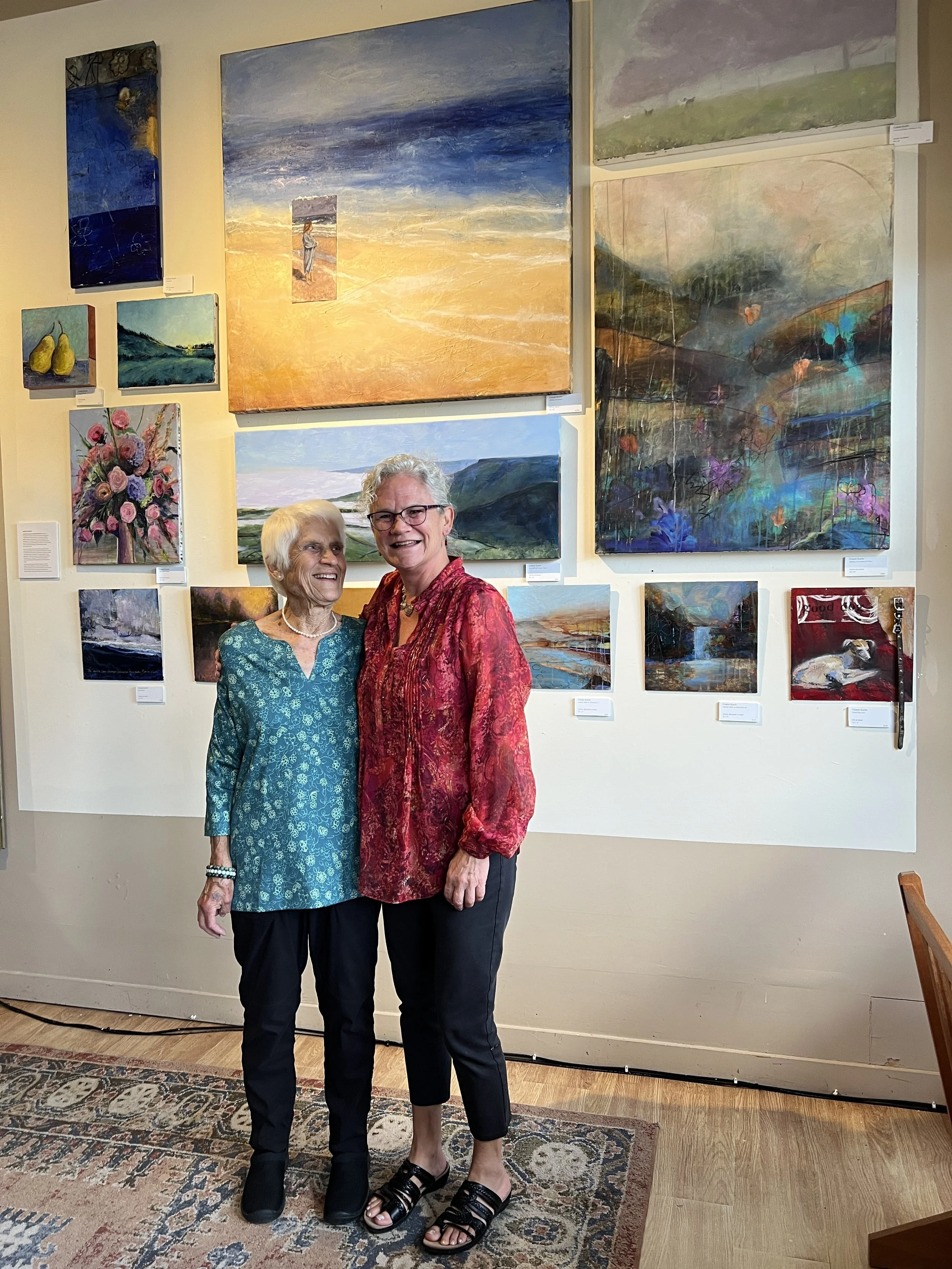 A photograph of Page Schley (L) and Connie Keetle (R) at Frame Gallery Gifts & Art in Sewanee, Tenn.
