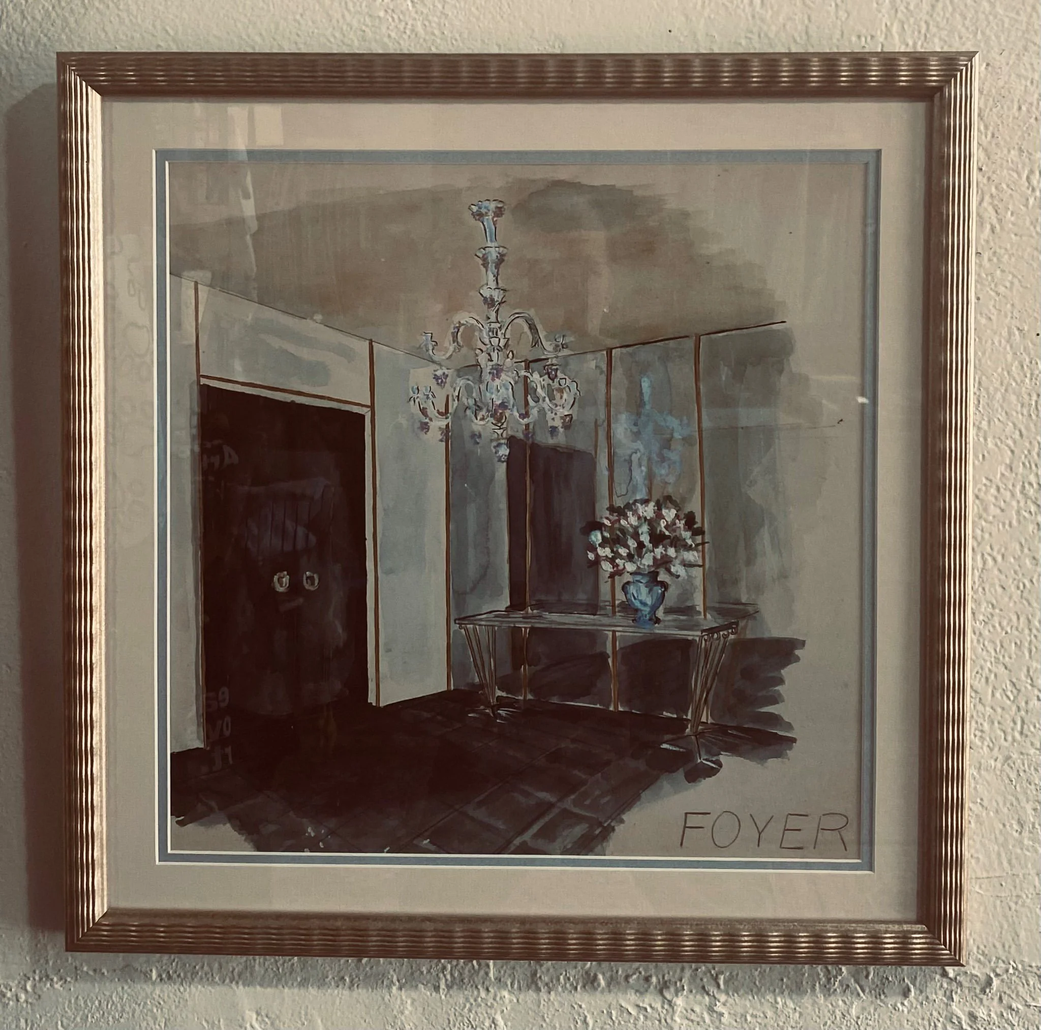 This mid-century watercolor, created by the father of one of our customers, is our #FavFrameFriday. The champagne-toned frame, with its soft, undulating lines, echoes the movement and lushness of the chandelier and flower vase. A blue inner mat bring