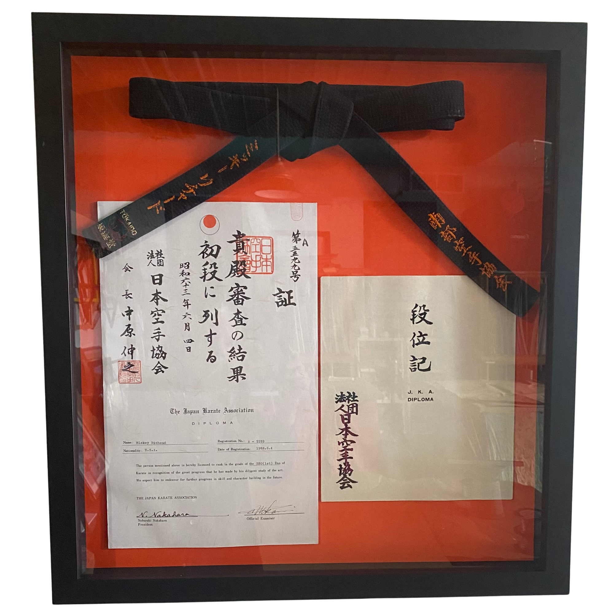 Earning a black belt is no small feat, and an achievement like this deserves more than a drawer or closet shelf. We designed a custom shadowbox to showcase the belt alongside the authentic paperwork that tells the full story of this accomplishment. F