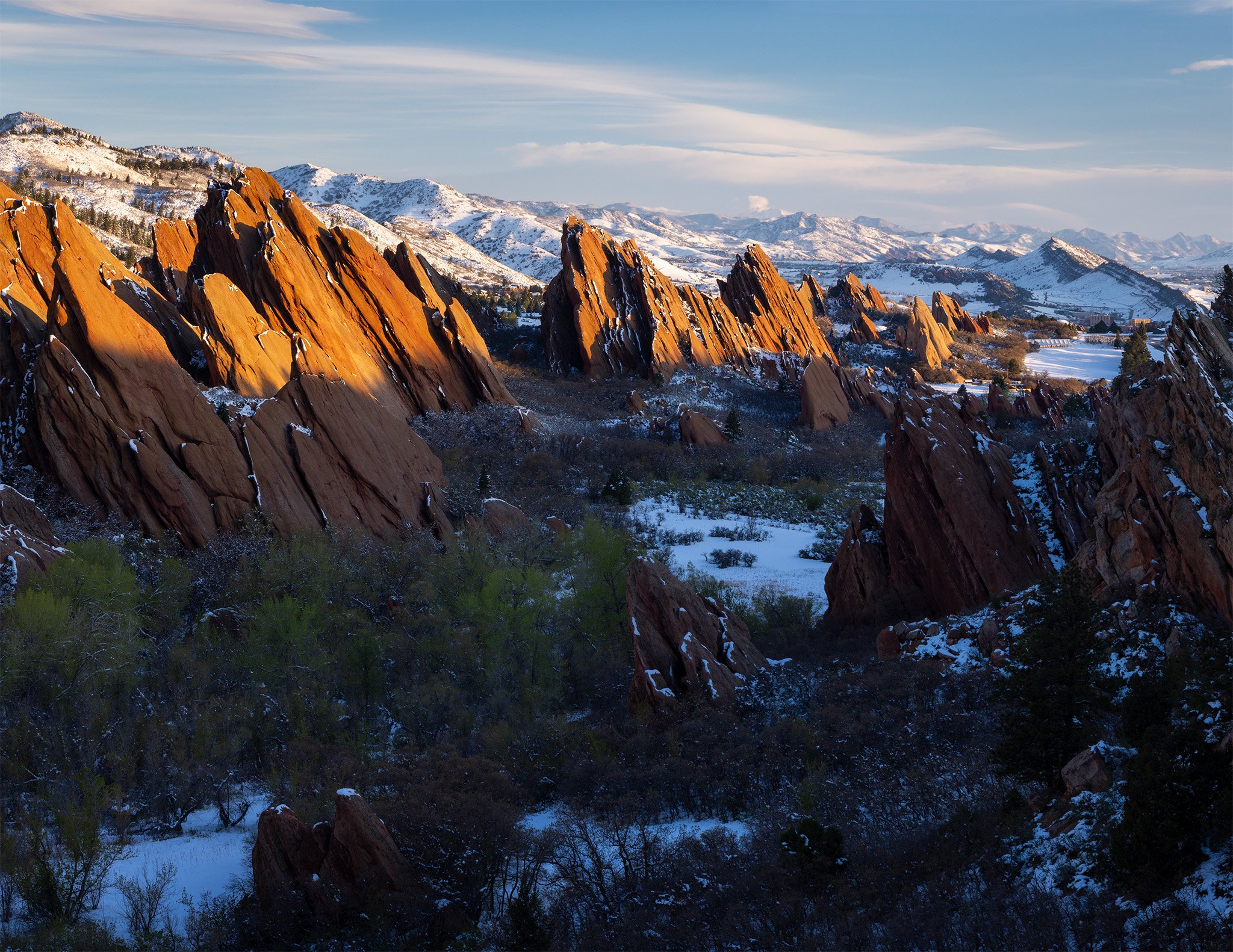 Morning light on tilted red rock formations after spring snow at Roxborough State Park, Douglas County, Colorado.
