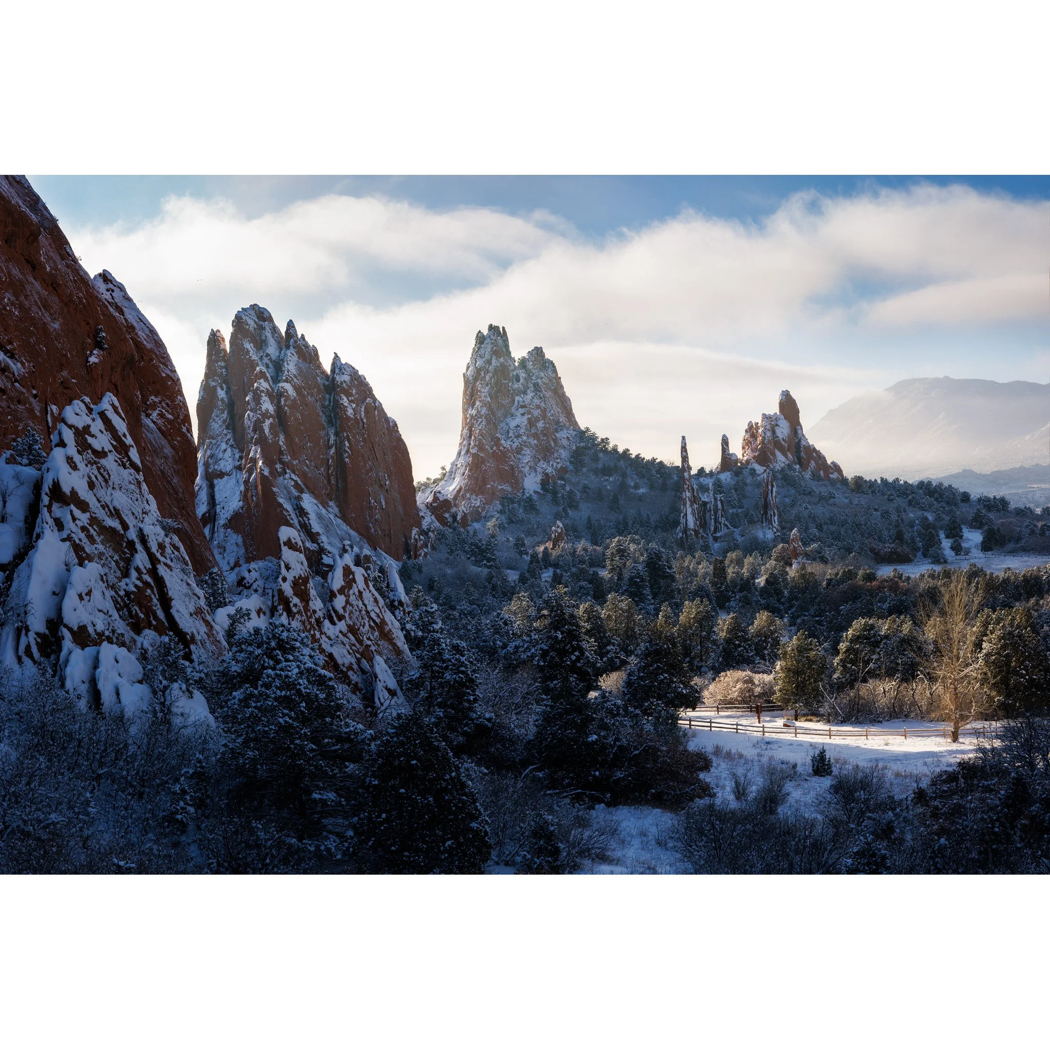 Snow-covered red rock formations at Garden of the Gods on a clear winter morning, Colorado Springs, Colorado.