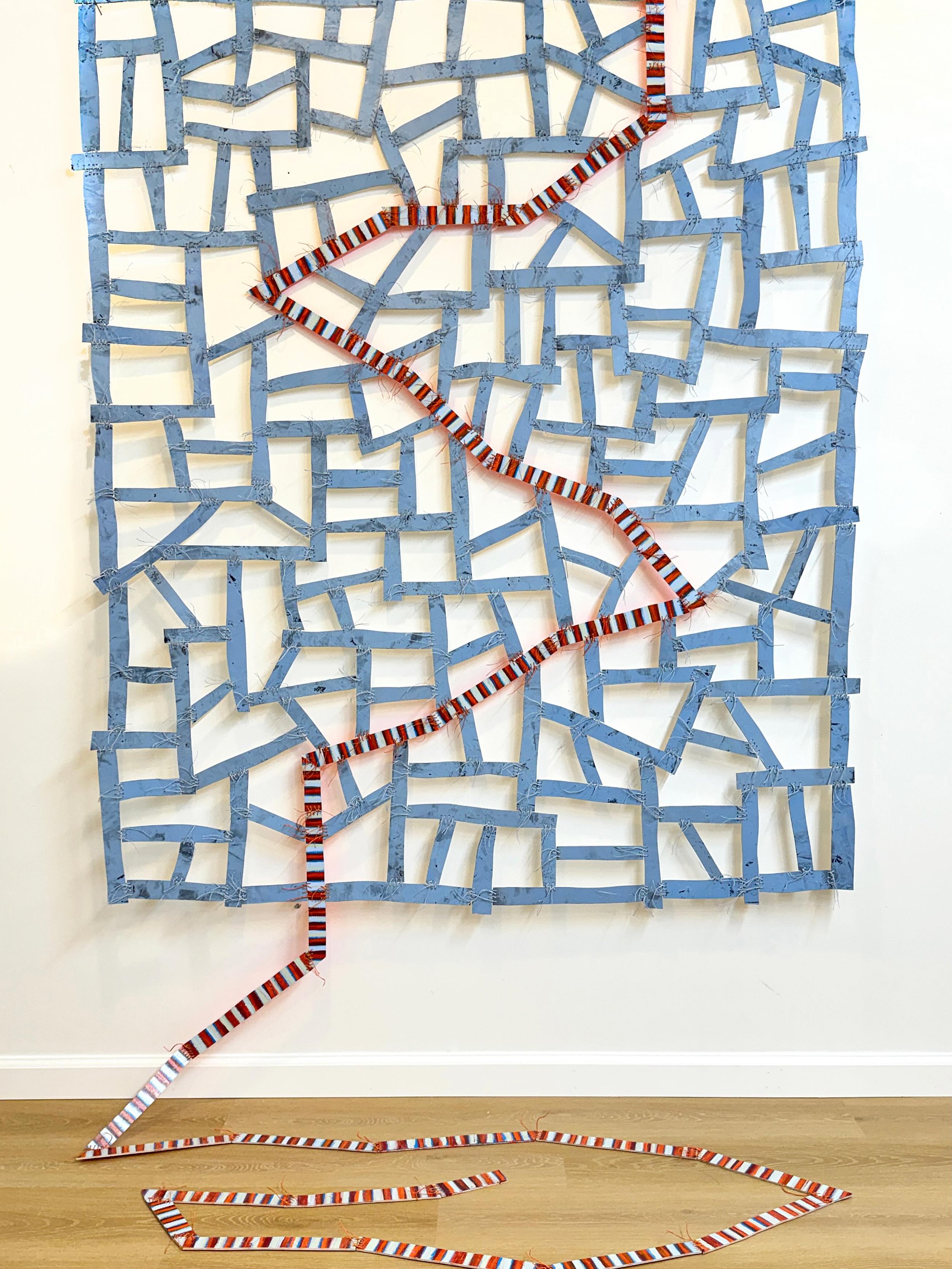 &ldquo;Spirit Line&rdquo; - wood, paint, thread. 

In Navajo weaving the &ldquo;spirit  line&rdquo; is the deliberate break in the border of a rug that allows the artist&rsquo;s creative spirit to escape the finished piece. It ensures the weaver reta