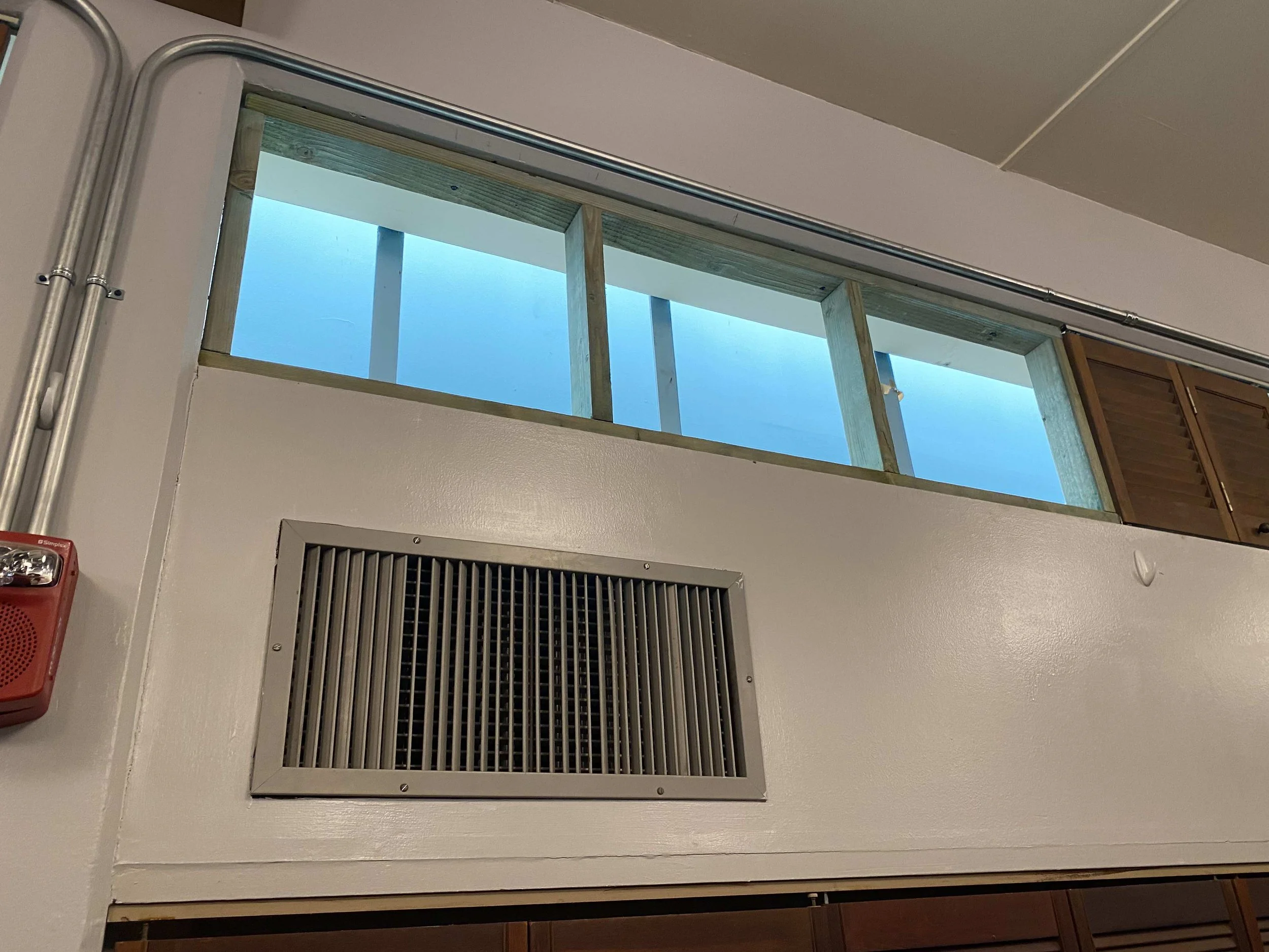 Window frame prepared for new AC unit installation.