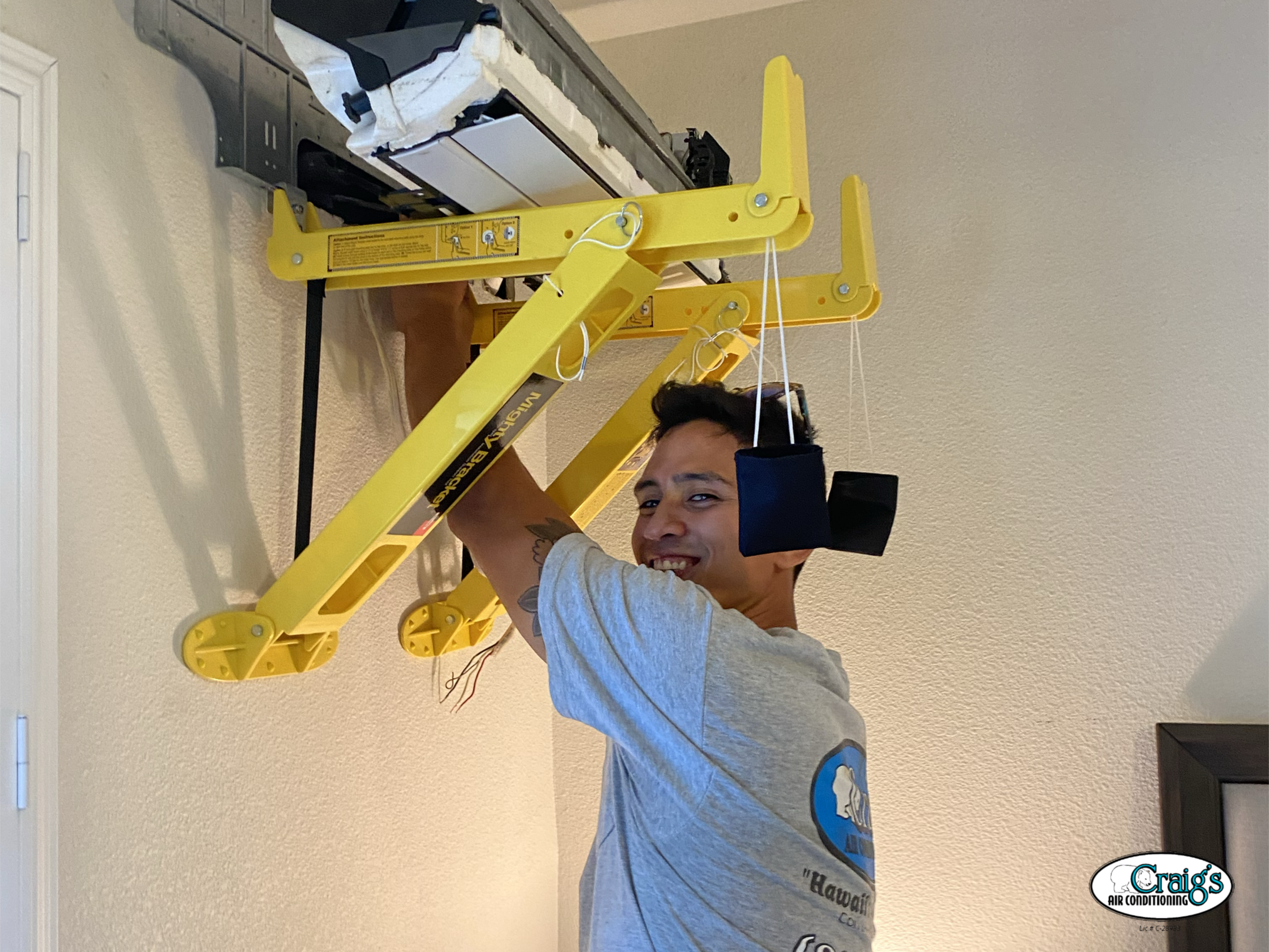 technician installing an air conditioner