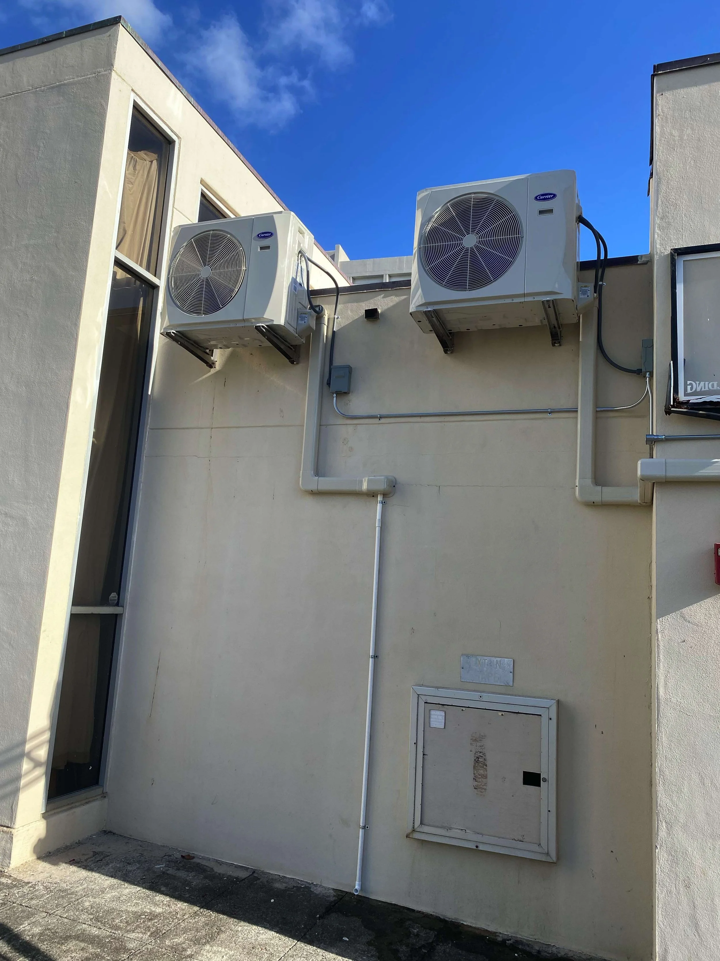 Closer look at two of the four outdoor AC units on the rooftop