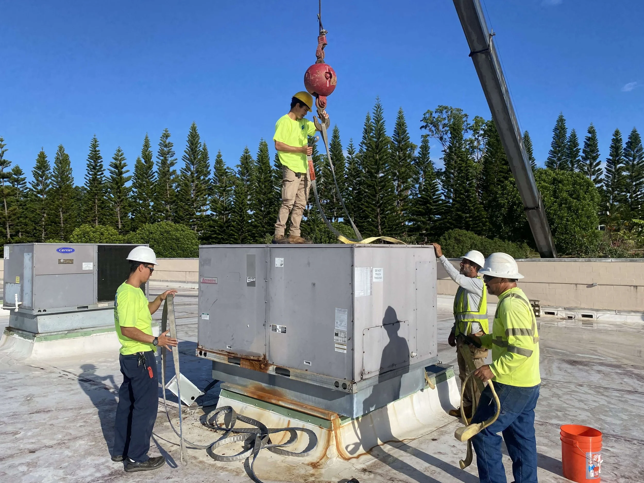 Techs_Preparing_HVAC_for_Crane_Lift.jpeg