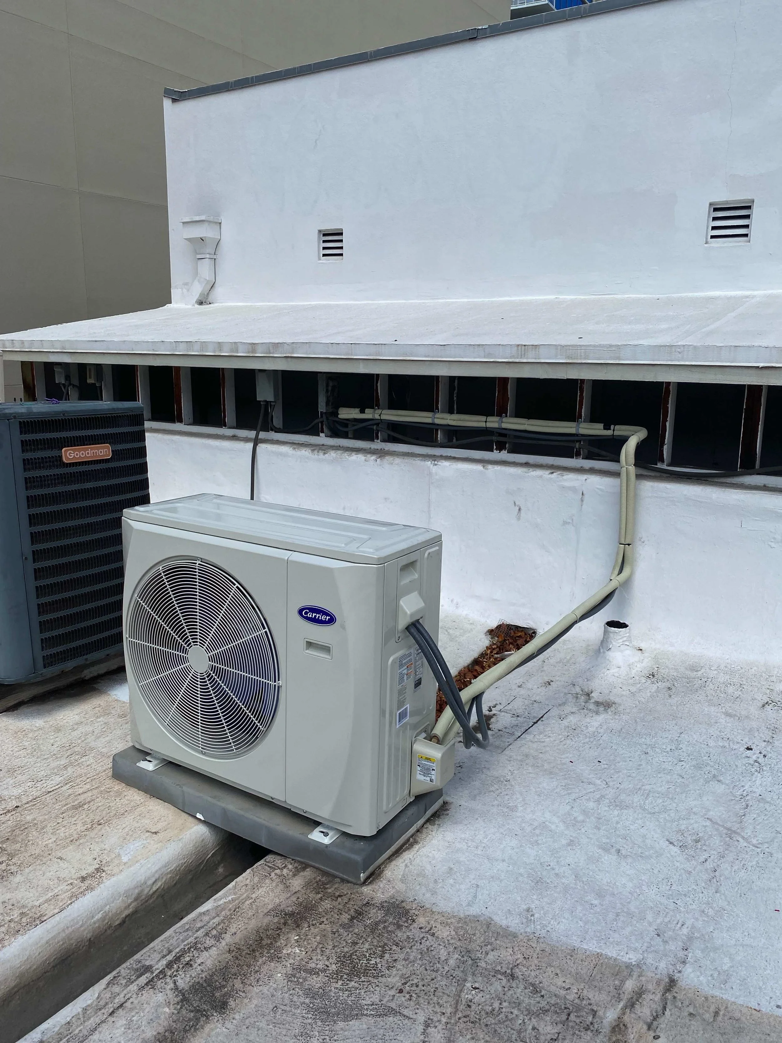 Different angle of the new outdoor HVAC system, showing the connecting piping