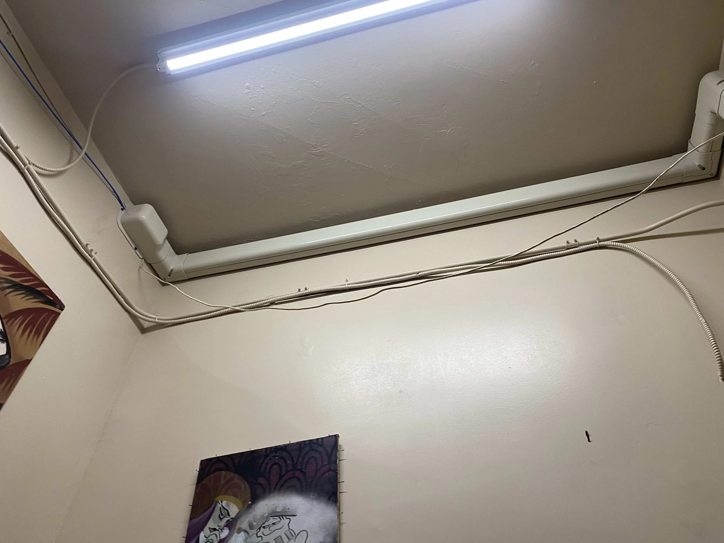 Pipe covers for the new HVAC system installed along the wall in a room