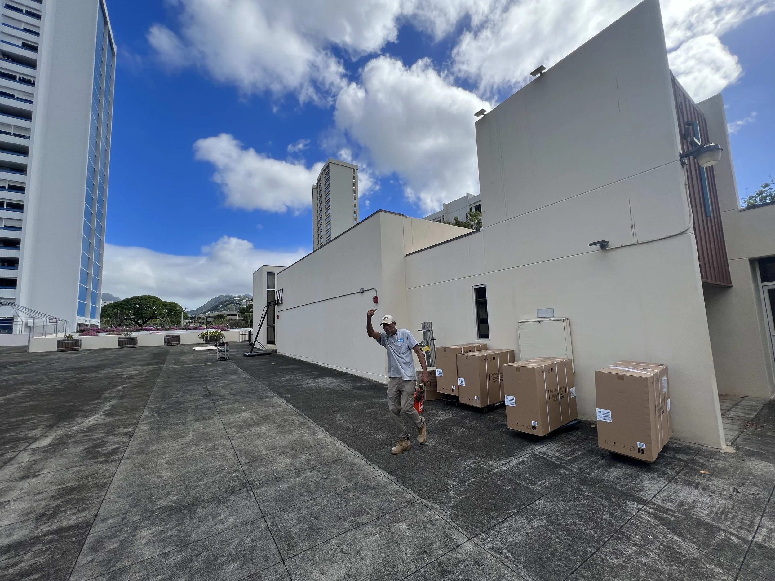 New boxed AC systems ready for rooftop installation.