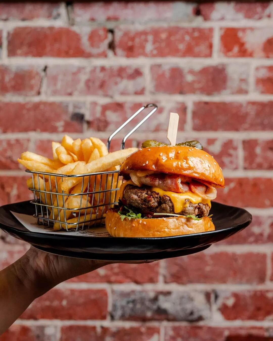 Wagyu burger - Brioche bun, wagyu beef patty, bacon, caramelised onion, American cheese, lettuce, pickles &amp; Halo burger dressing served with fries&nbsp;🤤