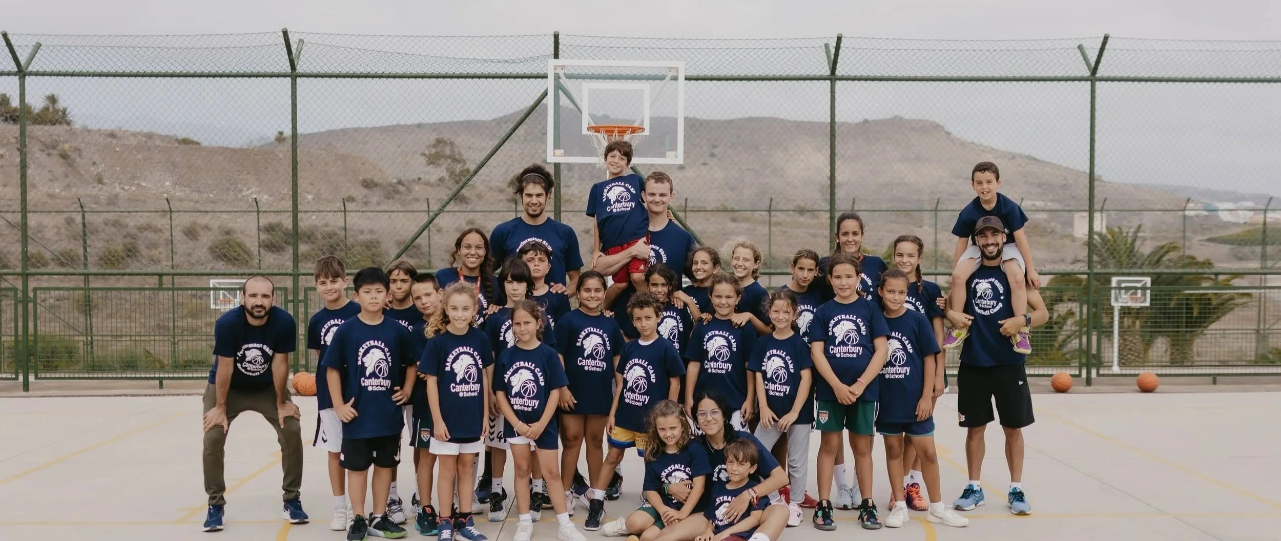 Canterbury basketball camp group on an outdoor court