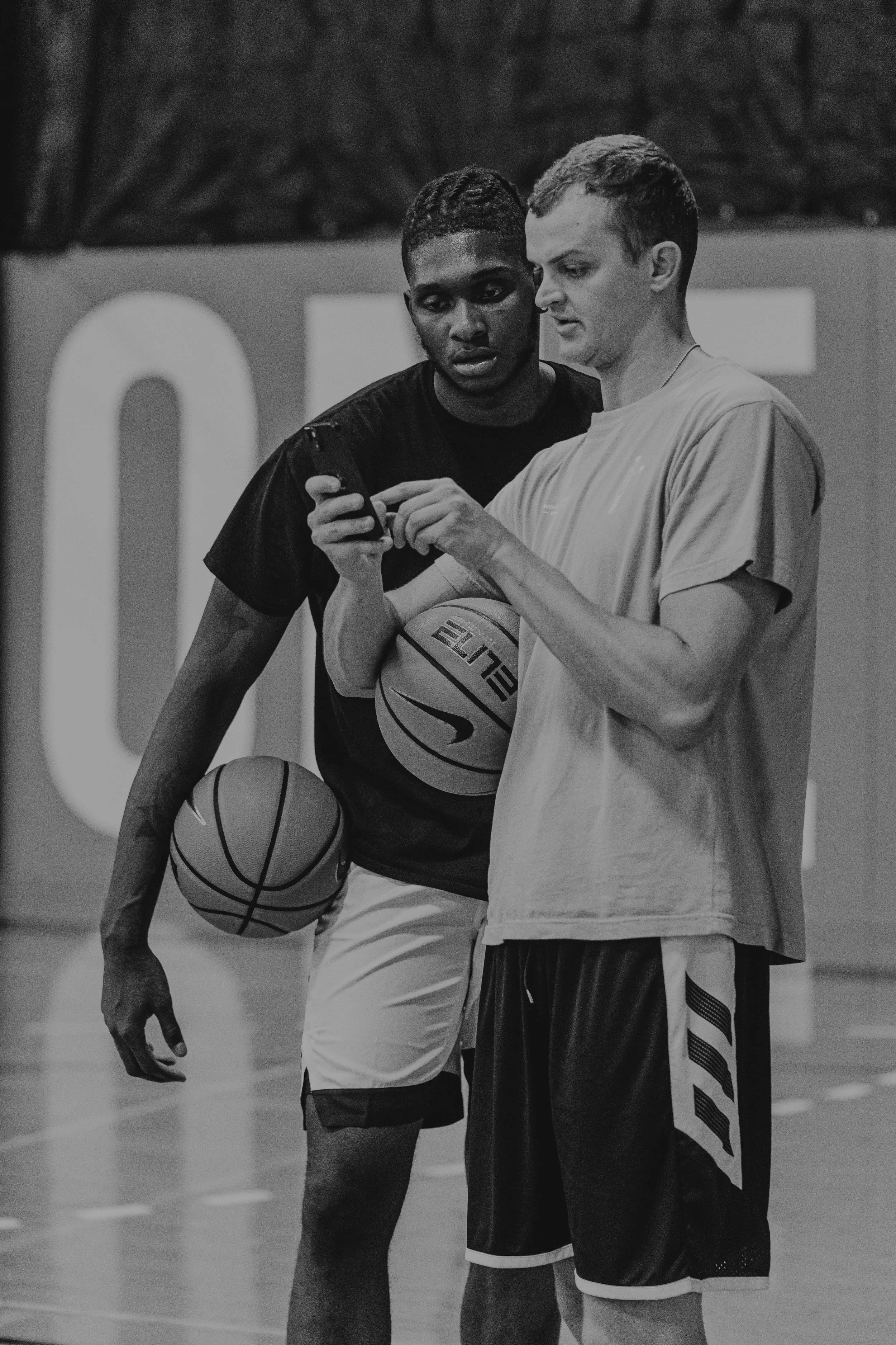 Coach and athlete reviewing basketball feedback