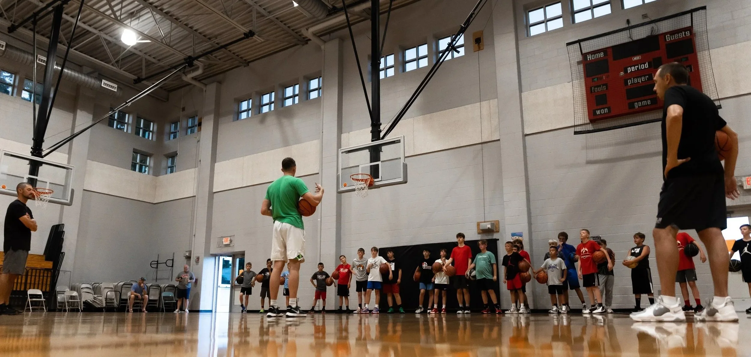 Group basketball instruction on the court