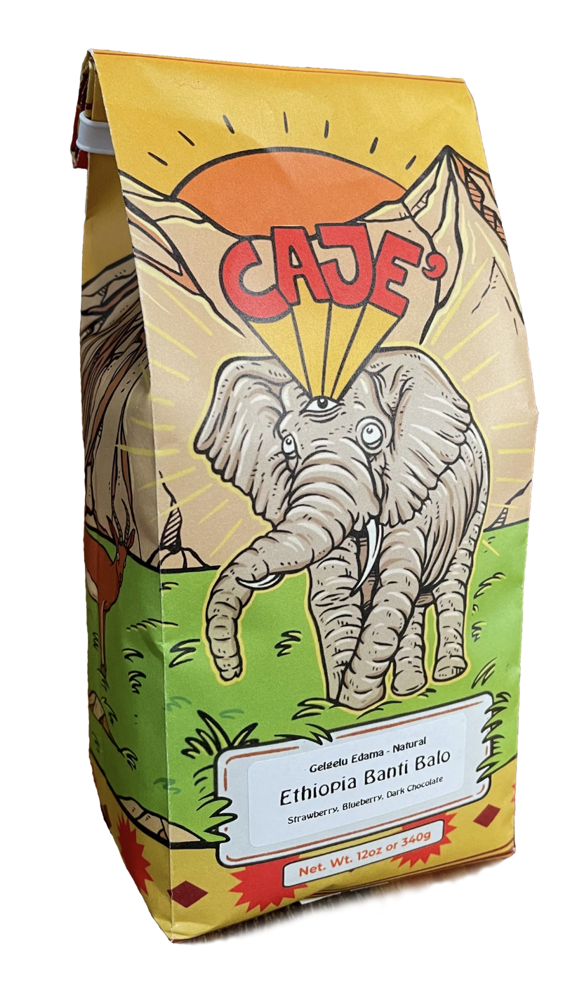 coffee pack for Cajè Coffee Santa Barbara picturing a radiant elephant with a third eye, walking through a green hill with rocky mountains behind it