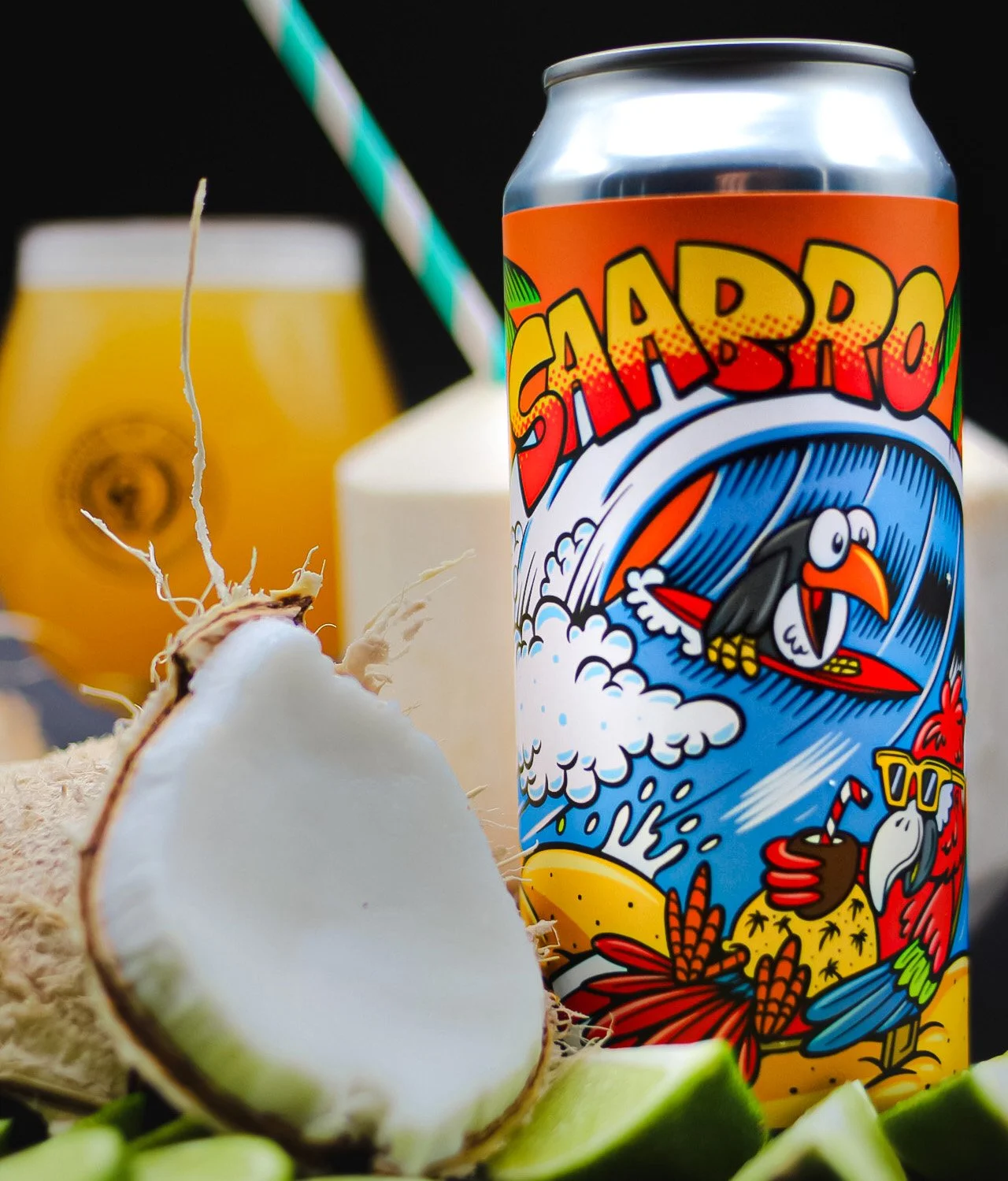 beer can illustration picturing a toucan surfing a nice left wave, while a parrot with shades is drinking from a coconut cup while resting on a beach chair