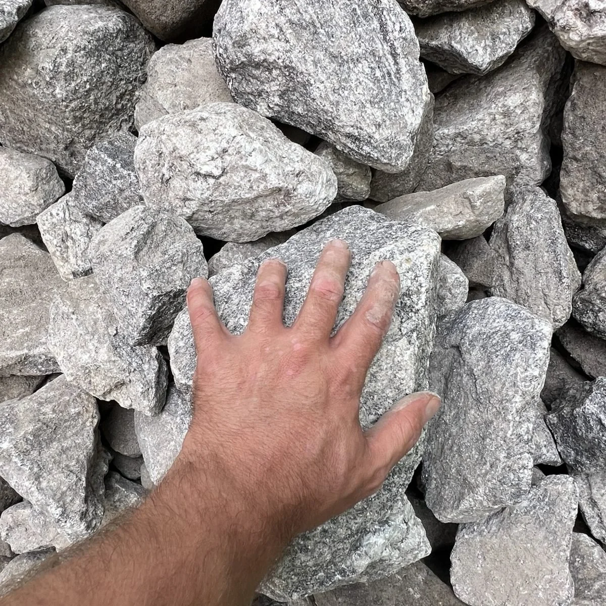 Class A rip rap 5 to 10 inches granite rock delivered in Greenville County, South Carolina for erosion control and drainage projects.