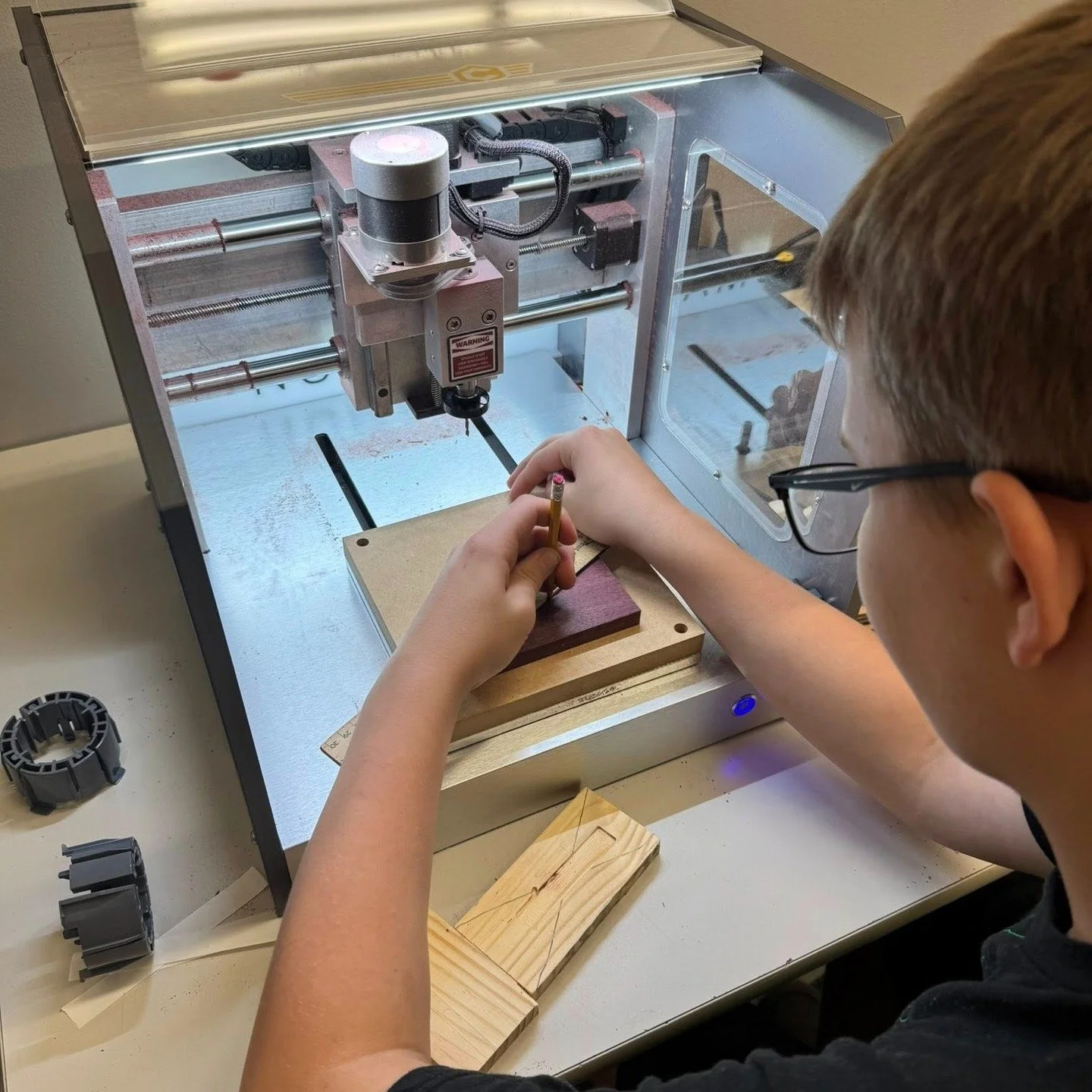 Students are taught how to design and create their own products using CNC router machines in the Innovation lab.