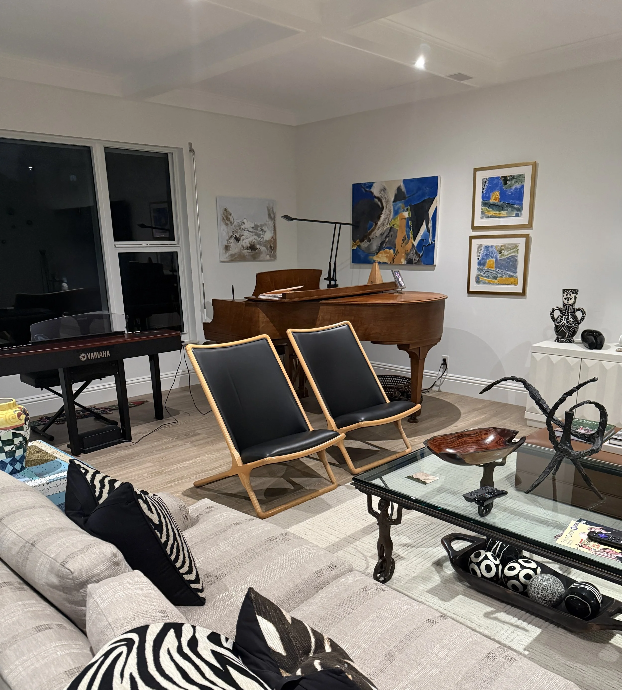 A corner installation of my work in a collector's home in Delray Beach with  "MYSTICAL LANDSCAPE", PICASSO FISH, mixed media paintings and 2 monoprints inspired by Italy