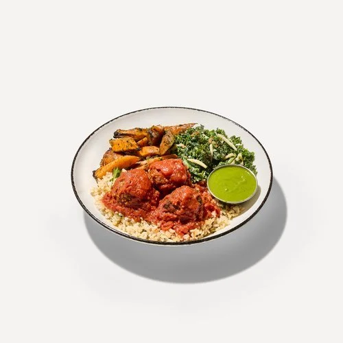 DIG Spicy Meatball dish with couscous and tomato ragù.
