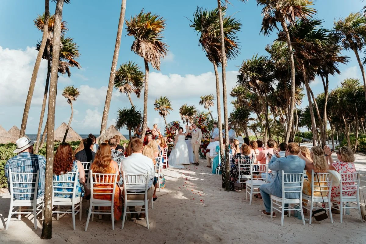 Floral wedding arch on the beach at Valentin Imperial Riviera Maya