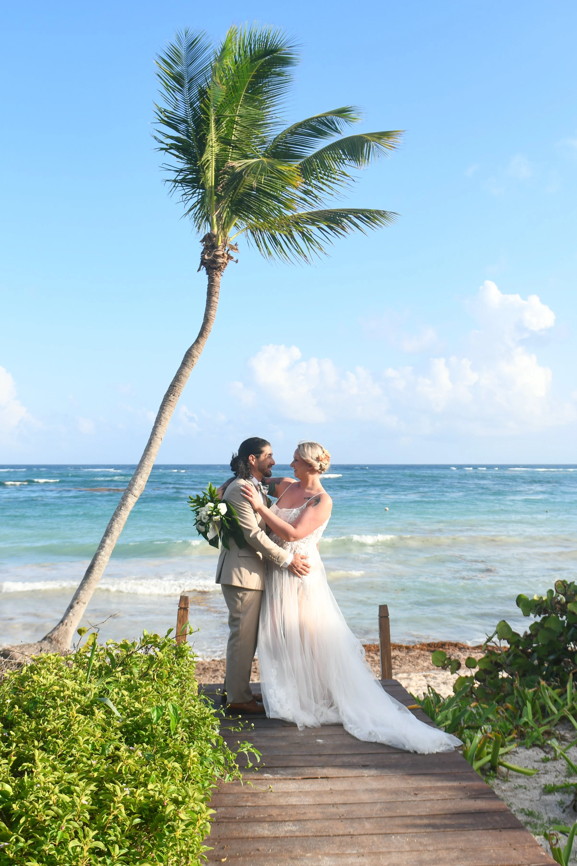 Destination wedding couple, wedding portrait ocean boardwalk, Secrets Tulum destination wedding