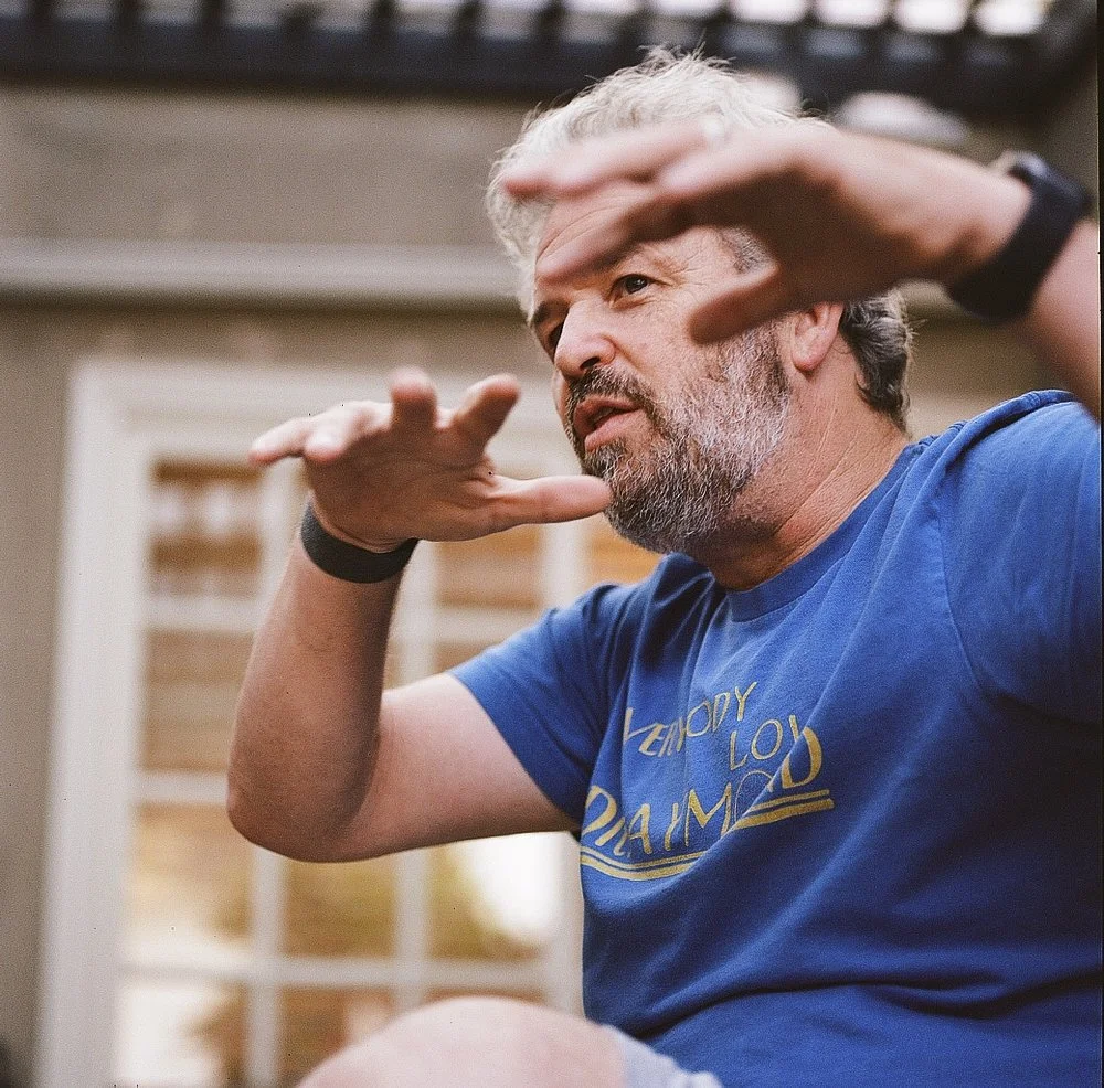 Jacob Rosenberg animatedly gesturing with his hands while speaking