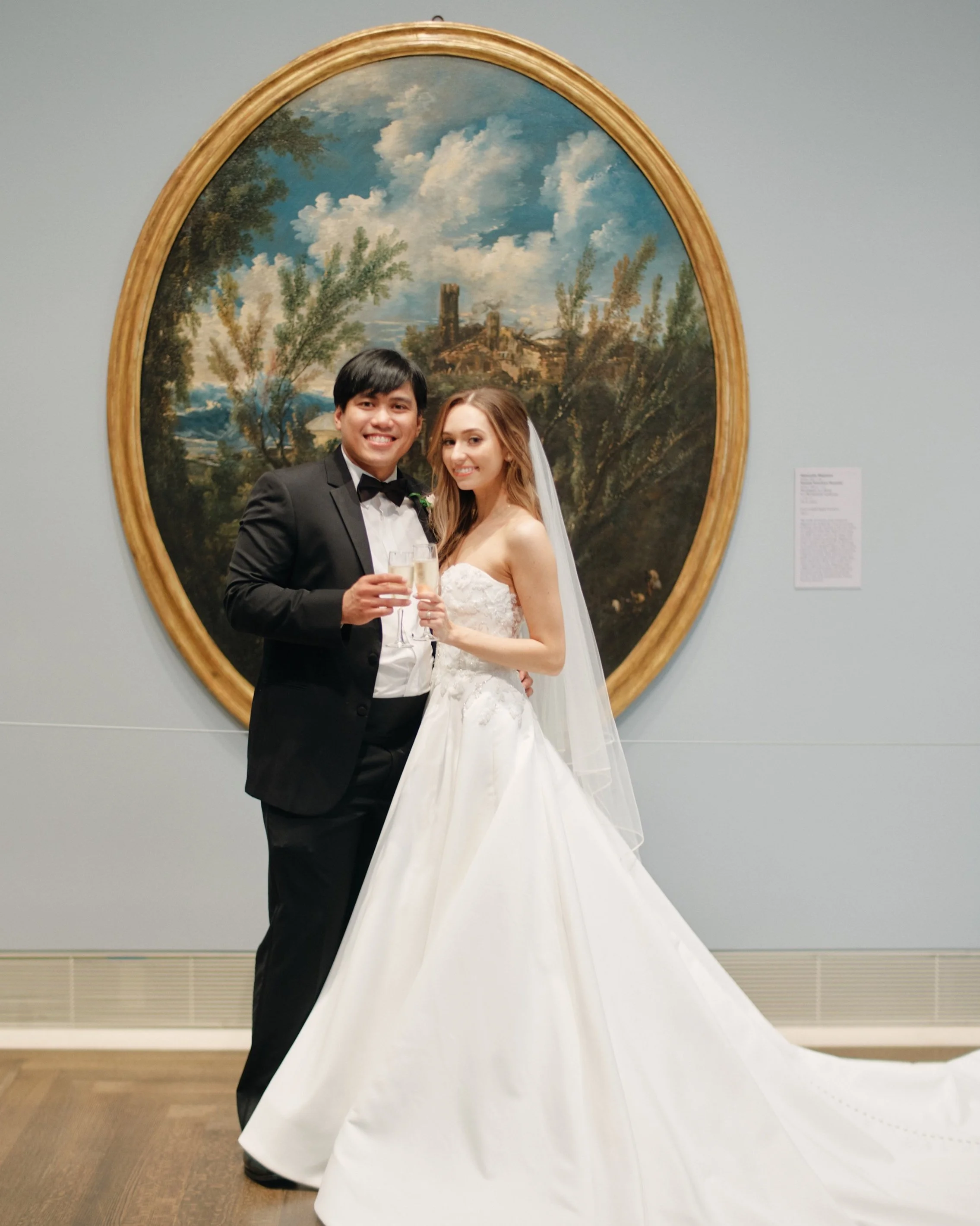 Couple posing in front of painting at the Museum of Fine Arts Houston