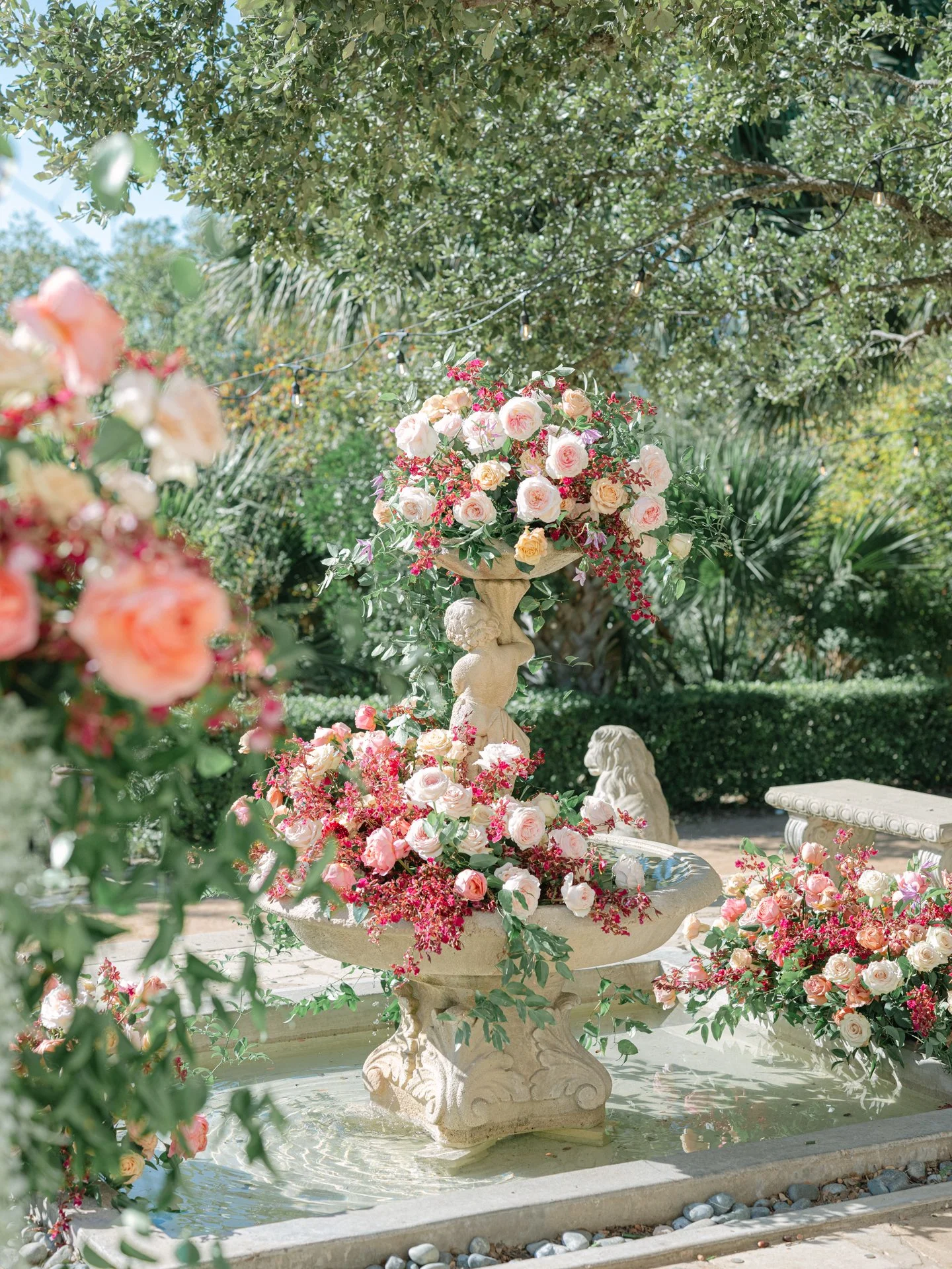Contemporary garden style florals decorating the fountain at the Contemporary Austin for an outdoor wedding installation