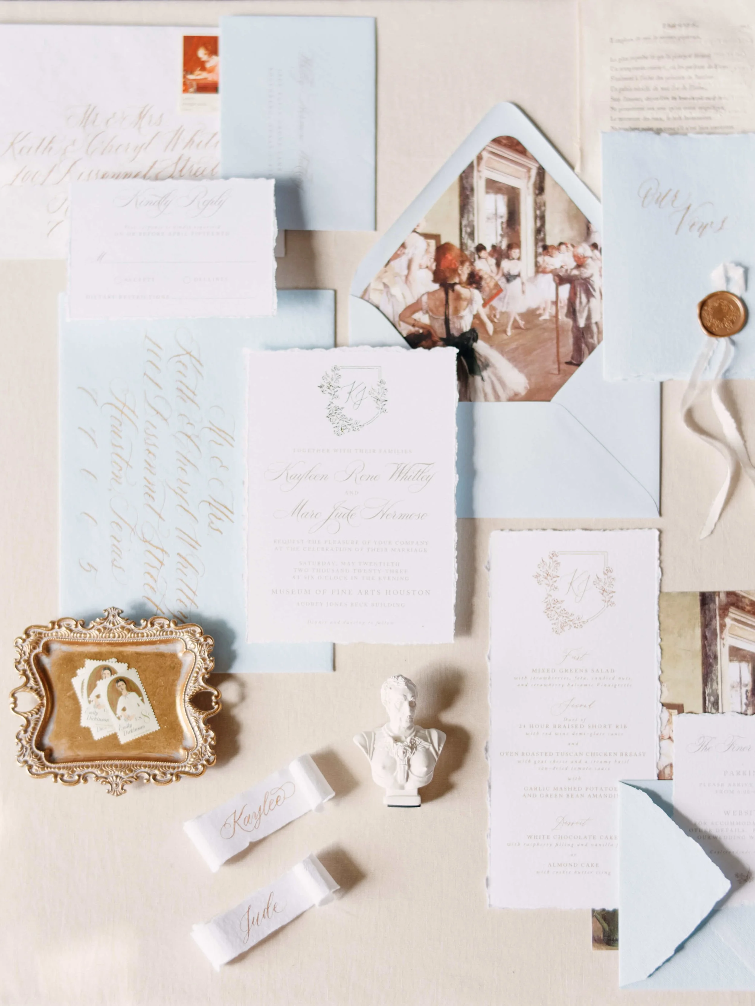 Flat lay of wedding invitation with art inspired flourishes for a wedding at Museum