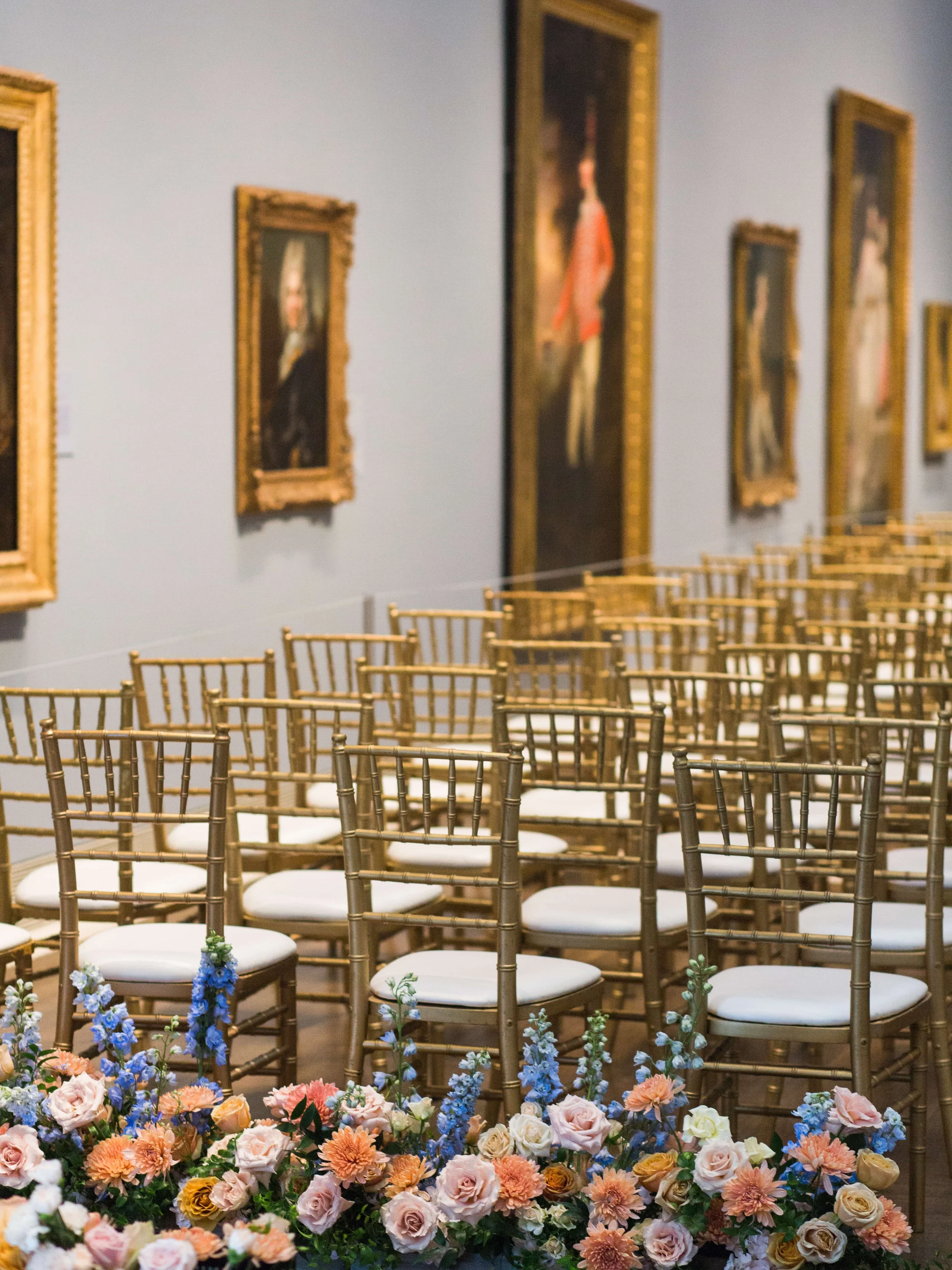 Floral meadow lining the wedding ceremony aisle at the Museum of Fine Arts Houston designed by The Petaler Floral & Events Co.