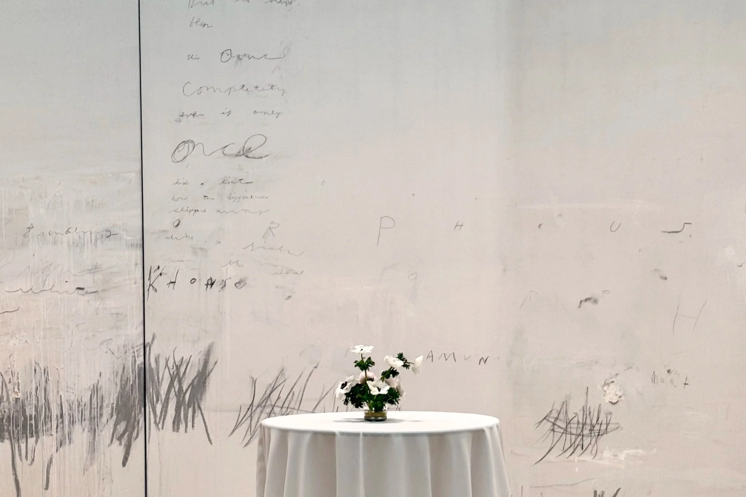 Anemone arrangement against a Cy Twombly painting at The Menil Collection in Houston, styled by The Petaler Floral & Events Co. for luxury weddings in the U.S. and France.