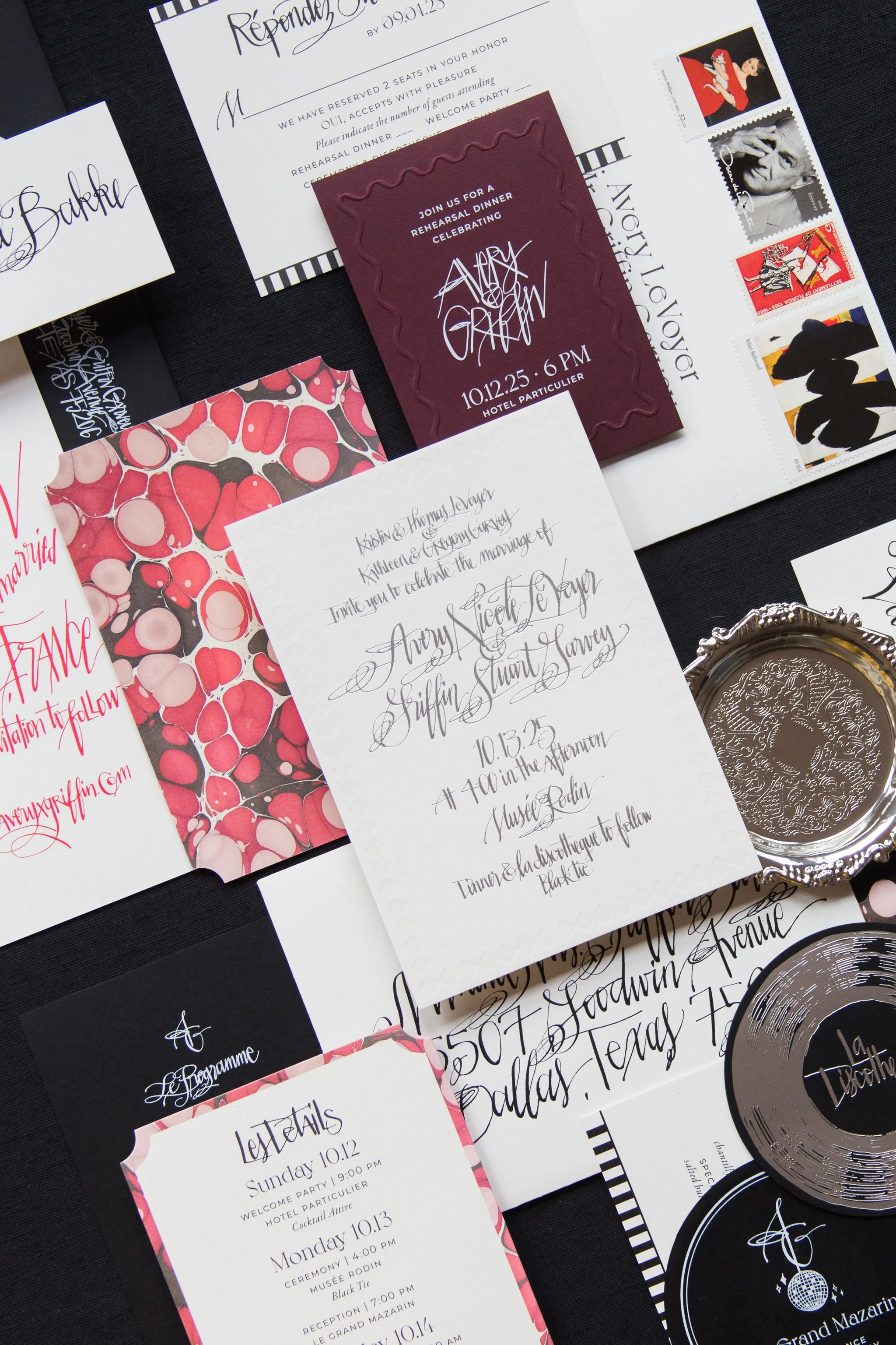 Bespoke wedding invitation suite for a Paris destination wedding featuring expressive calligraphy, burgundy and blush stationery, custom illustrated details, vintage-inspired postage stamps, and silver accents for a celebration at Musée Rodin.