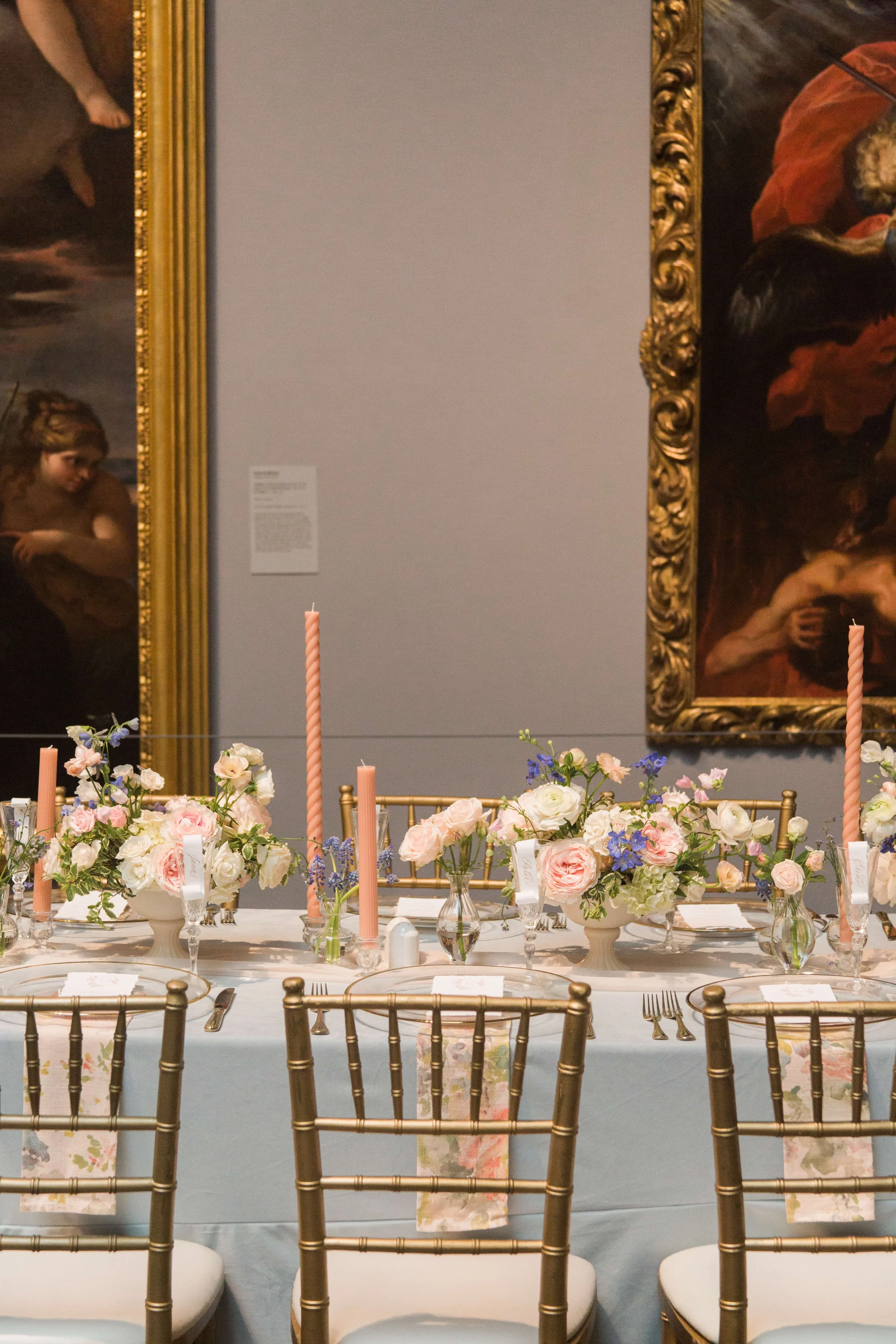 Floral filled head table with spring florals and soft pin candles at the Museum of Fine Arts, Houston