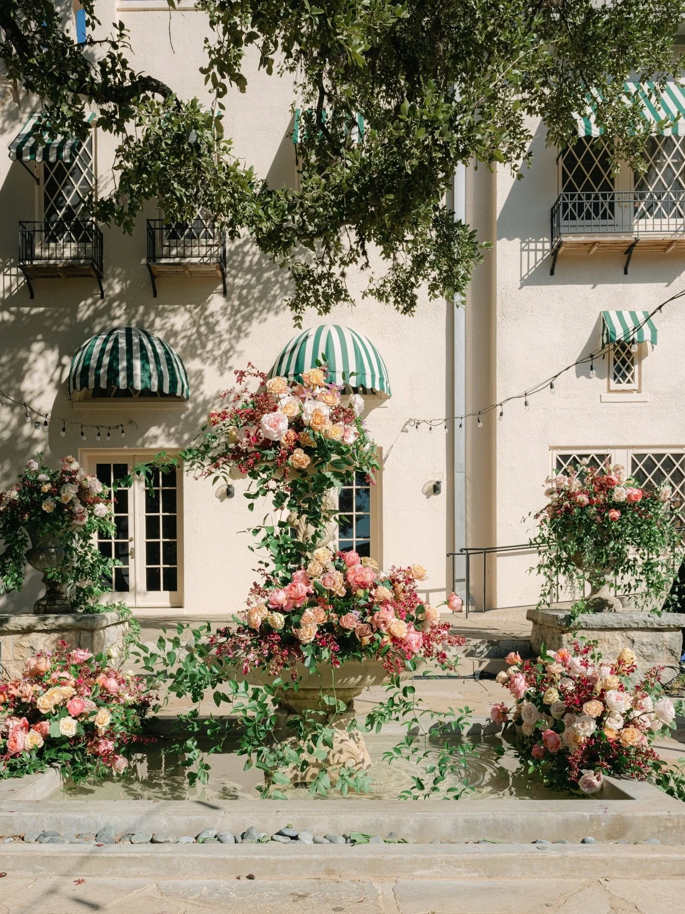 Contemporary garden style floral installation adorning the fountain at the Contemporary Austin