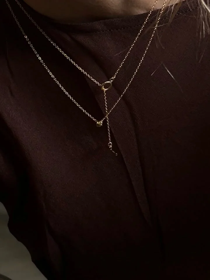 The finer version of our best-selling Loop Necklace. An 8mm loop and 11mm bar form the tiny toggle that connects our 1.2mm Cable Chain. Wear on its own or combine with one of our other necklaces or chains as an everyday stack. 

Get 10% off your firs