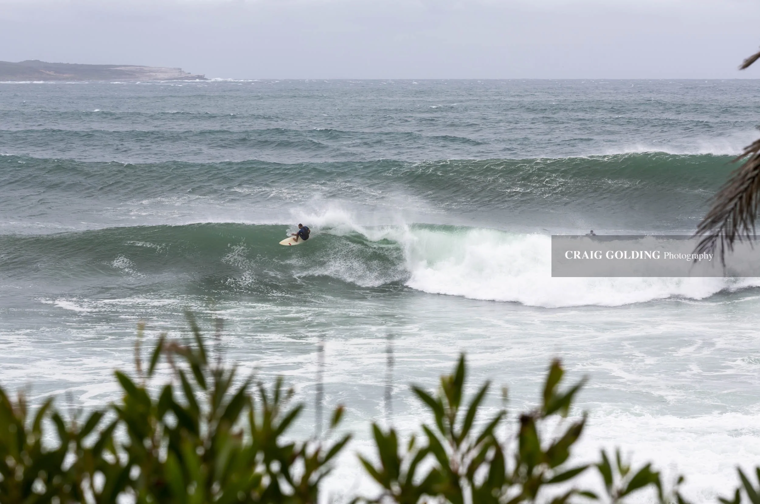 Surfers at Cronulla point.