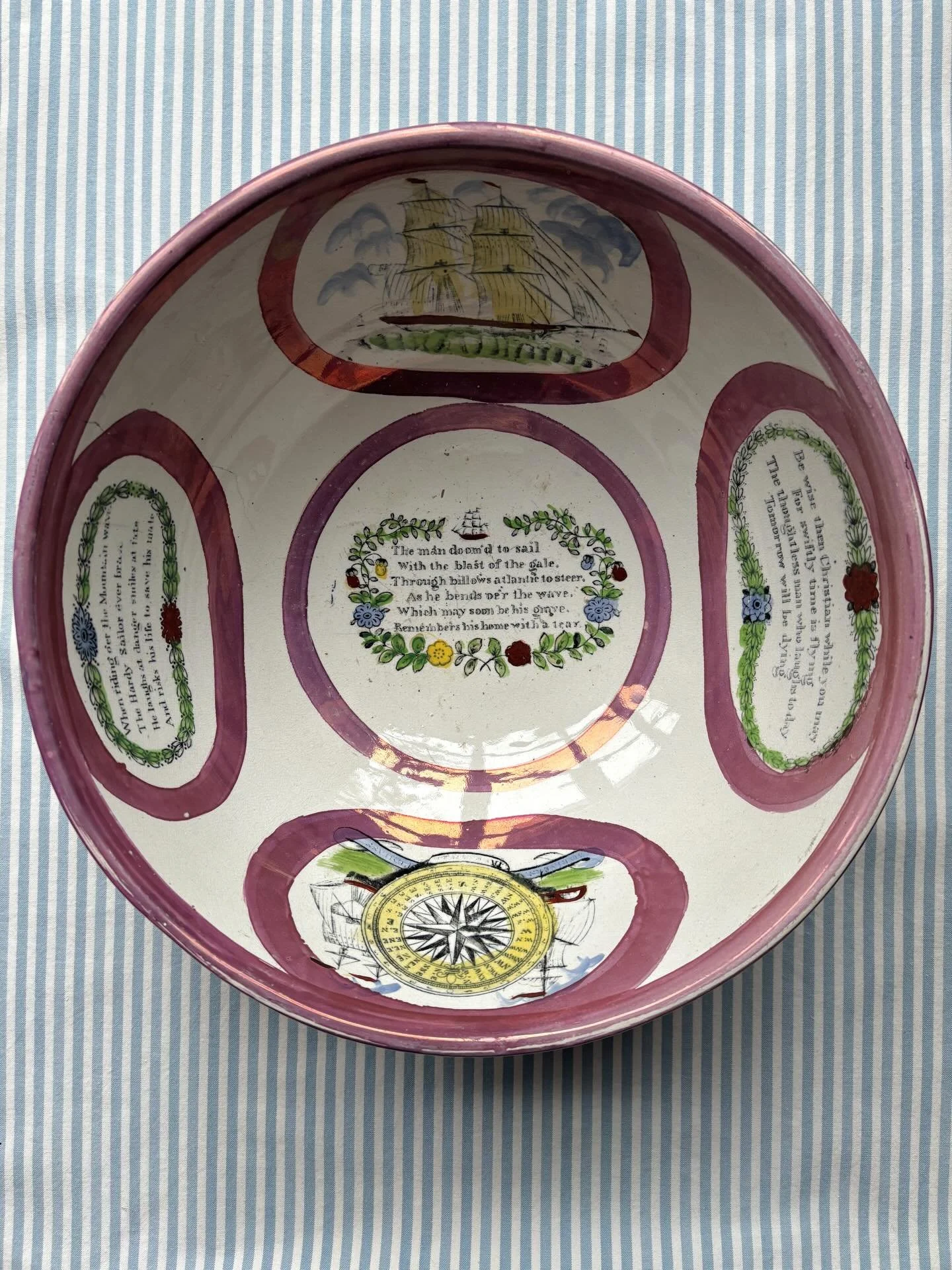 FOR SALE A magnificent large antique Sunderland lustreware bowl featuring maritime verses and images, each encircled by lustrous pink glaze, circa 1850. The images include three ships at full sail and a superb mariner&rsquo;s compass flanked by tall 