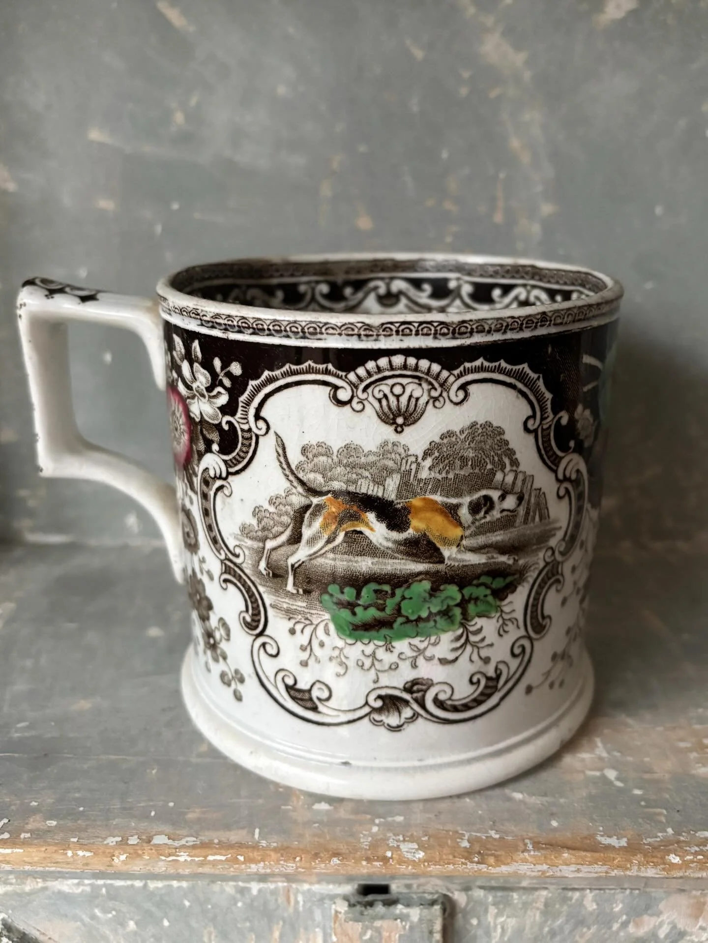 FOR SALE A superlative mid 19th century large transferware cider mug or tankard. 

It is transfer printed in dark brown with hand colouring in green, yellow ochre, plum red and blue. The pattern is fabulously detailed incorporating two hunting scenes