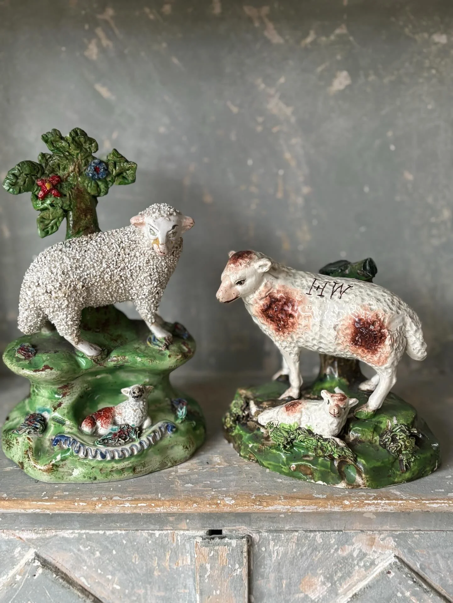 SOLD 🌟 Two early antique Staffordshire pottery sheep. 

1.) An early Staffordshire pottery ewe with lamb on a mound base, circa 1820. The modelling is particularly lovely with such charming expressions on the faces of the ewe and lamb!

The letters 