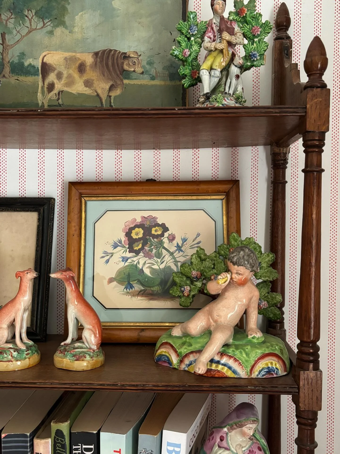 One of my favourite recent finds, I just adore this plump little putto, so busy spying through his telescope. There are so many wonderful details including the unusually decorative base, the bocage with trios of flowers, the expression of such concen